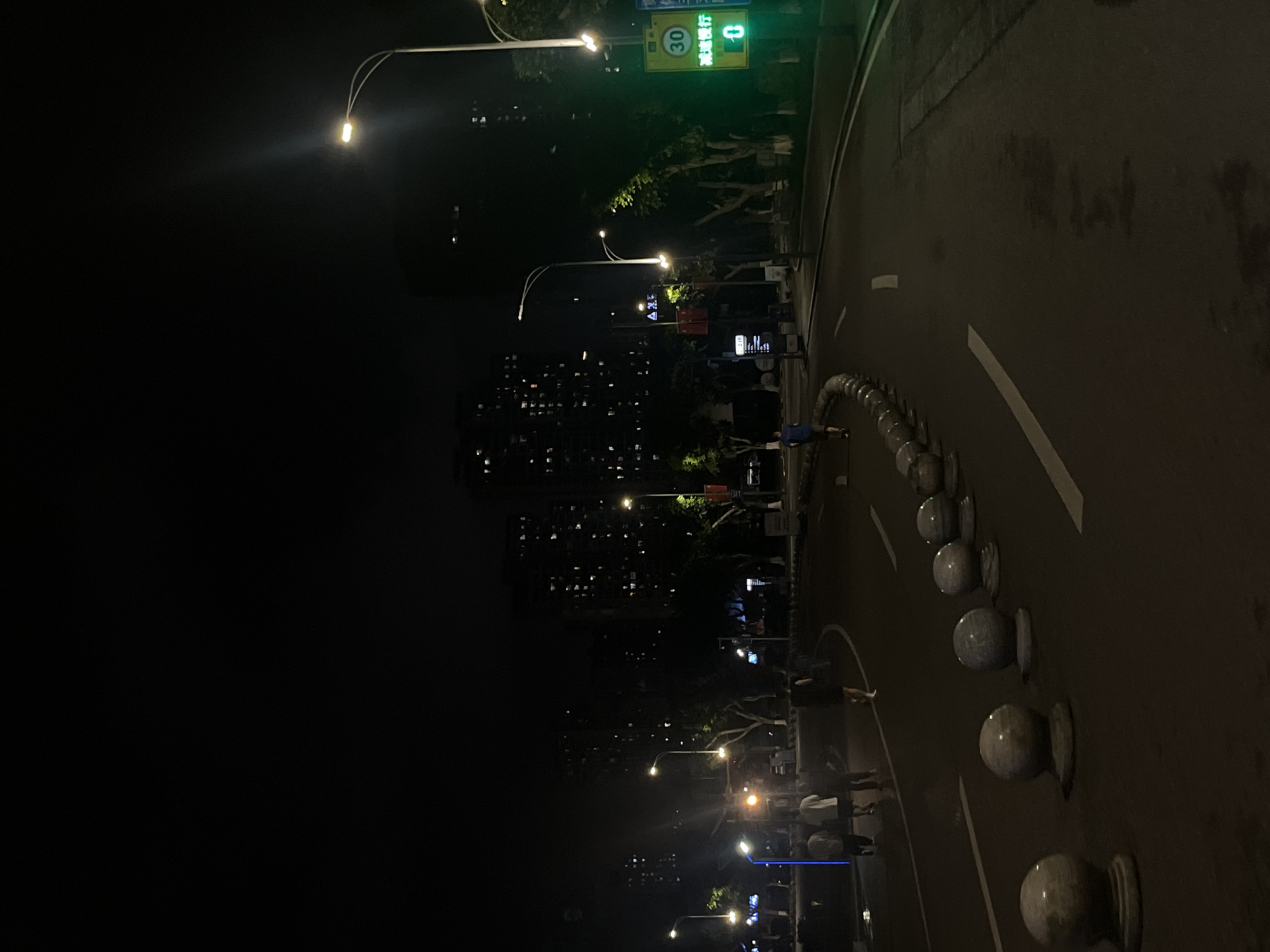 Nighttime scooter ride documented in Jiulongpo District, China