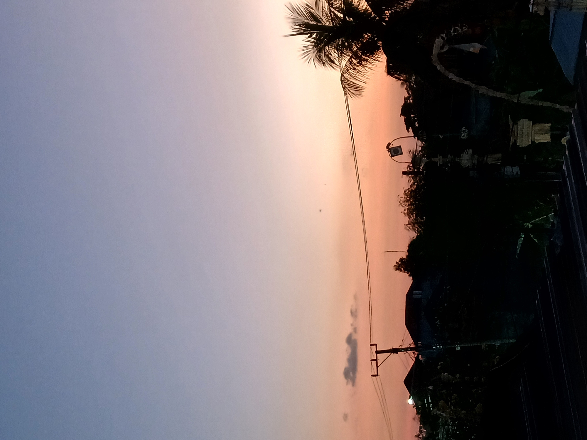 Mengwi at dawn: rice paddies, Balinese streets, and a glowing sky