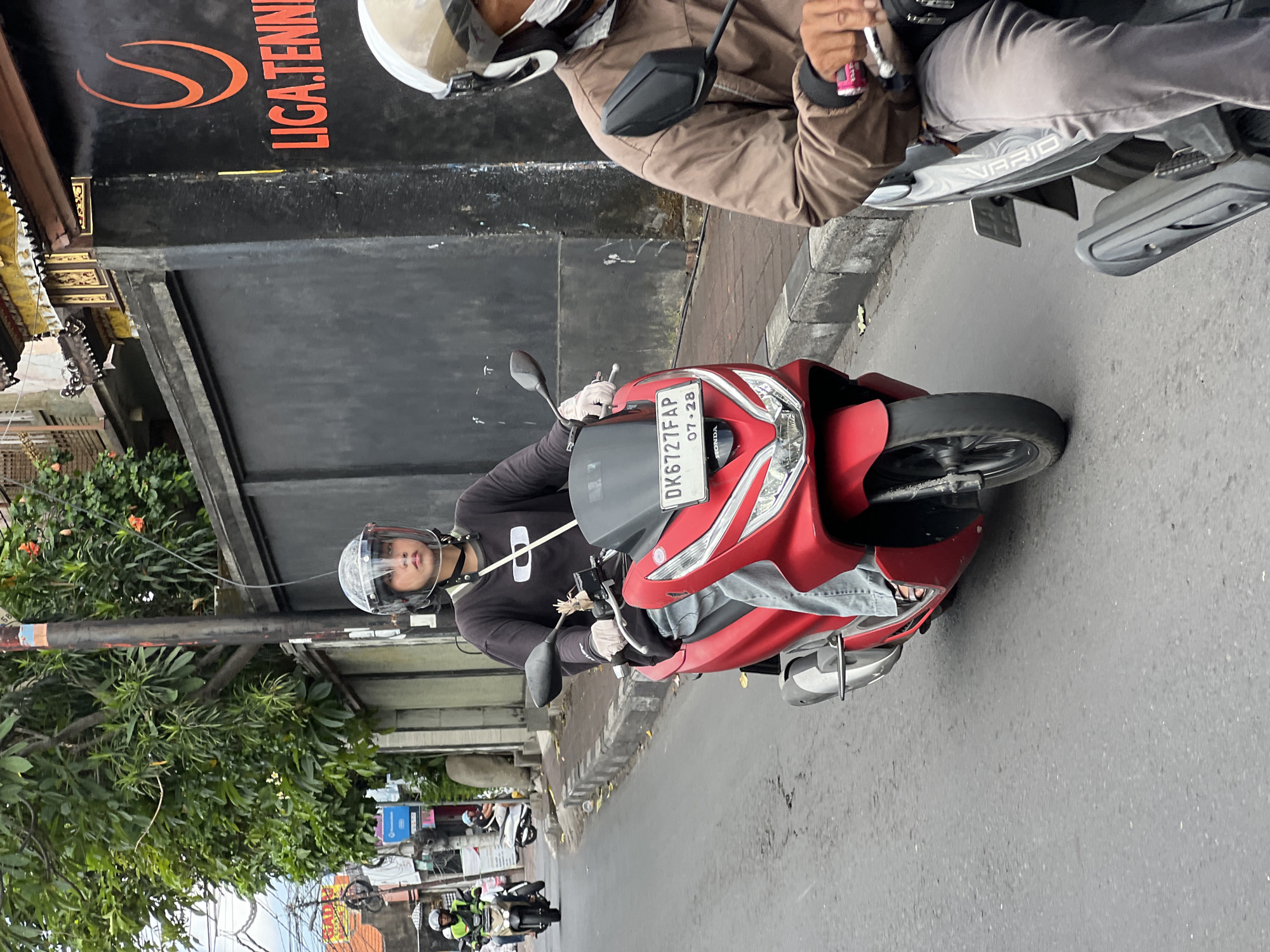 Morning scooter traffic documented in North Kuta, Indonesia