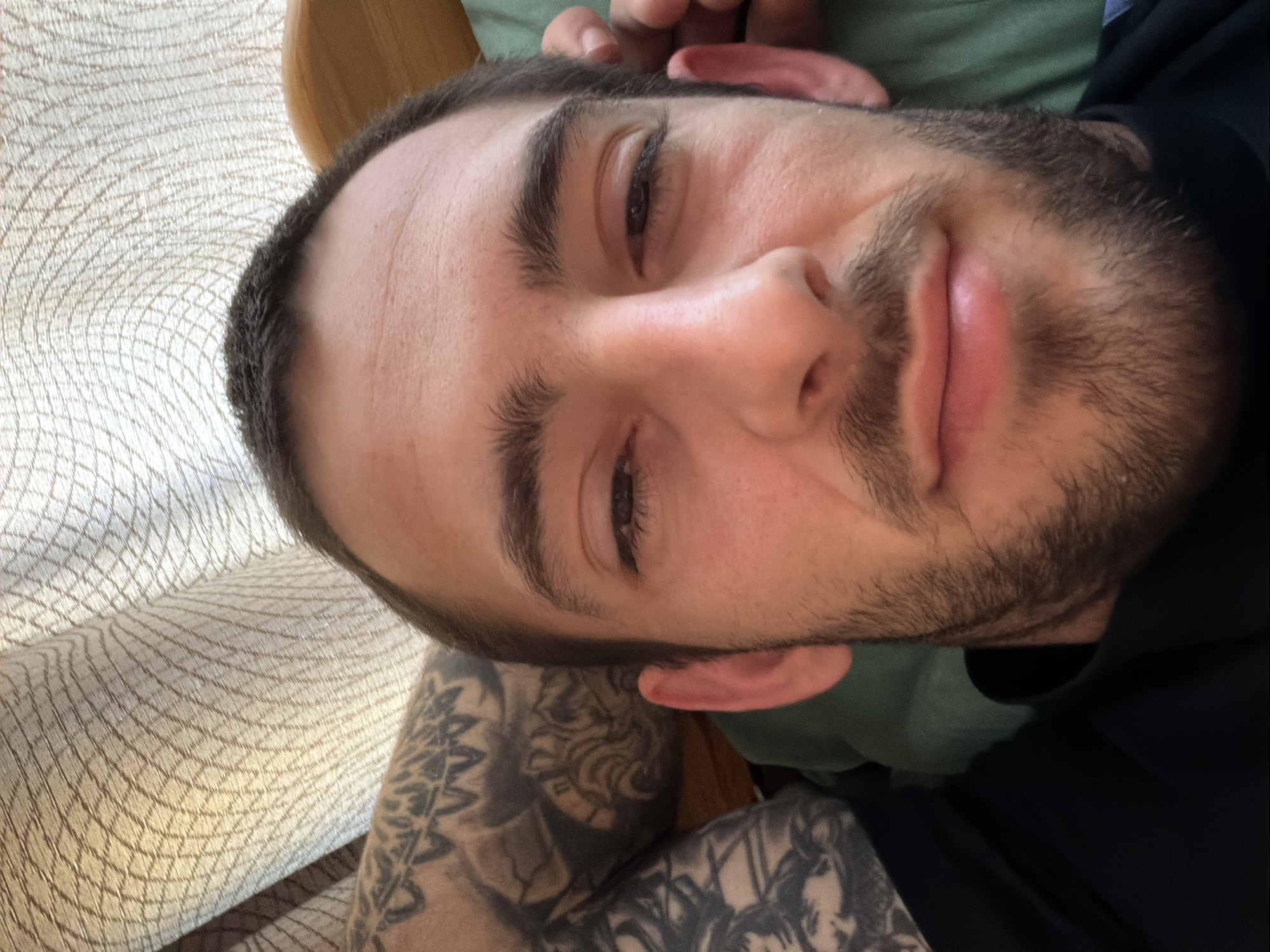 Man takes morning selfie on couch in Plovdiv