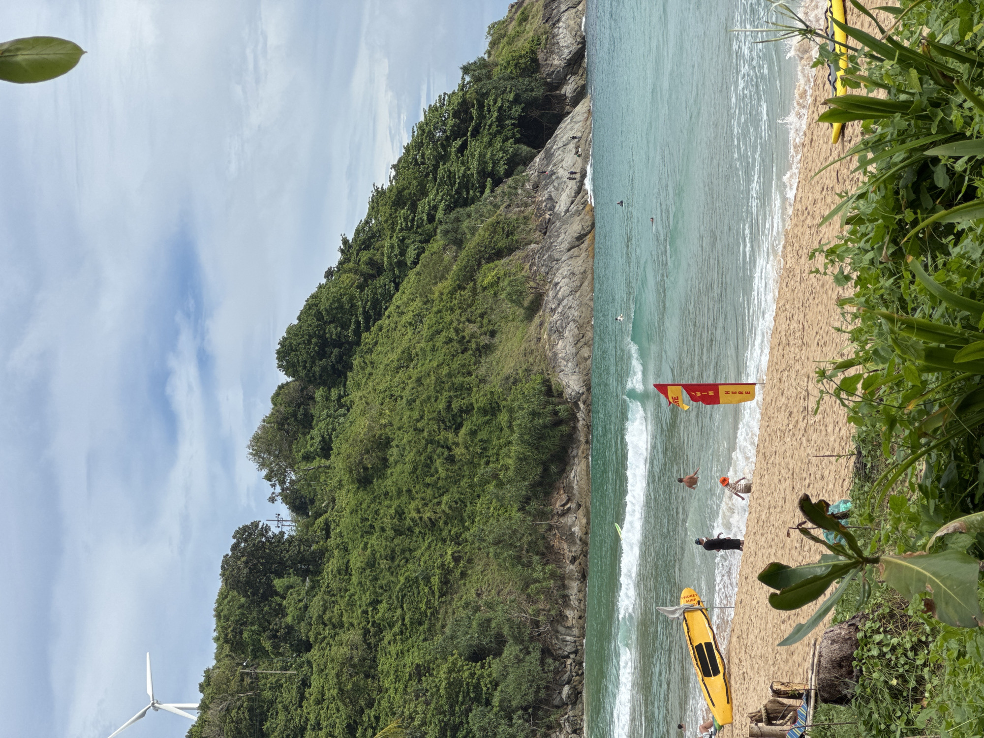 Lazy morning at Rawai beach — coconuts, coast, and a fruit stand