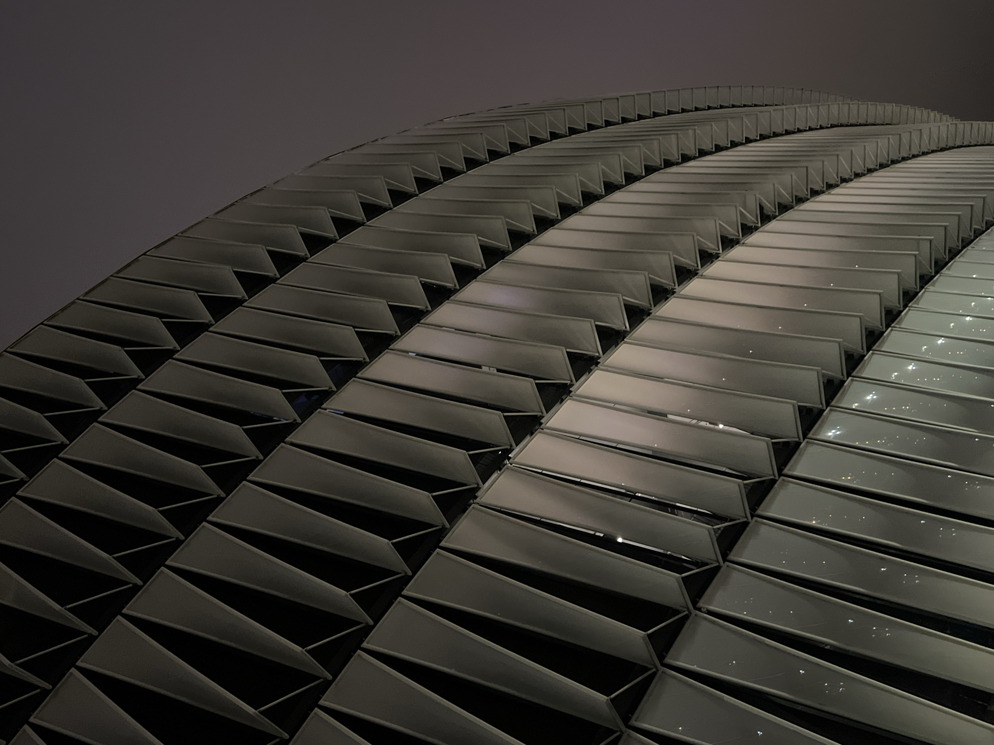 San Mamés Stadium exterior glowing at night in Bilbao