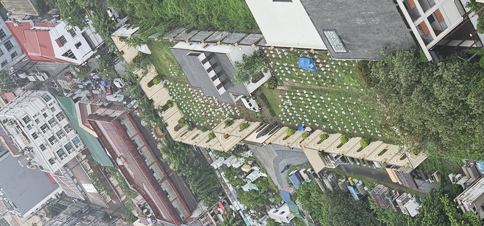Aerial sweep of Makati's skyline and Manila Memorial Park