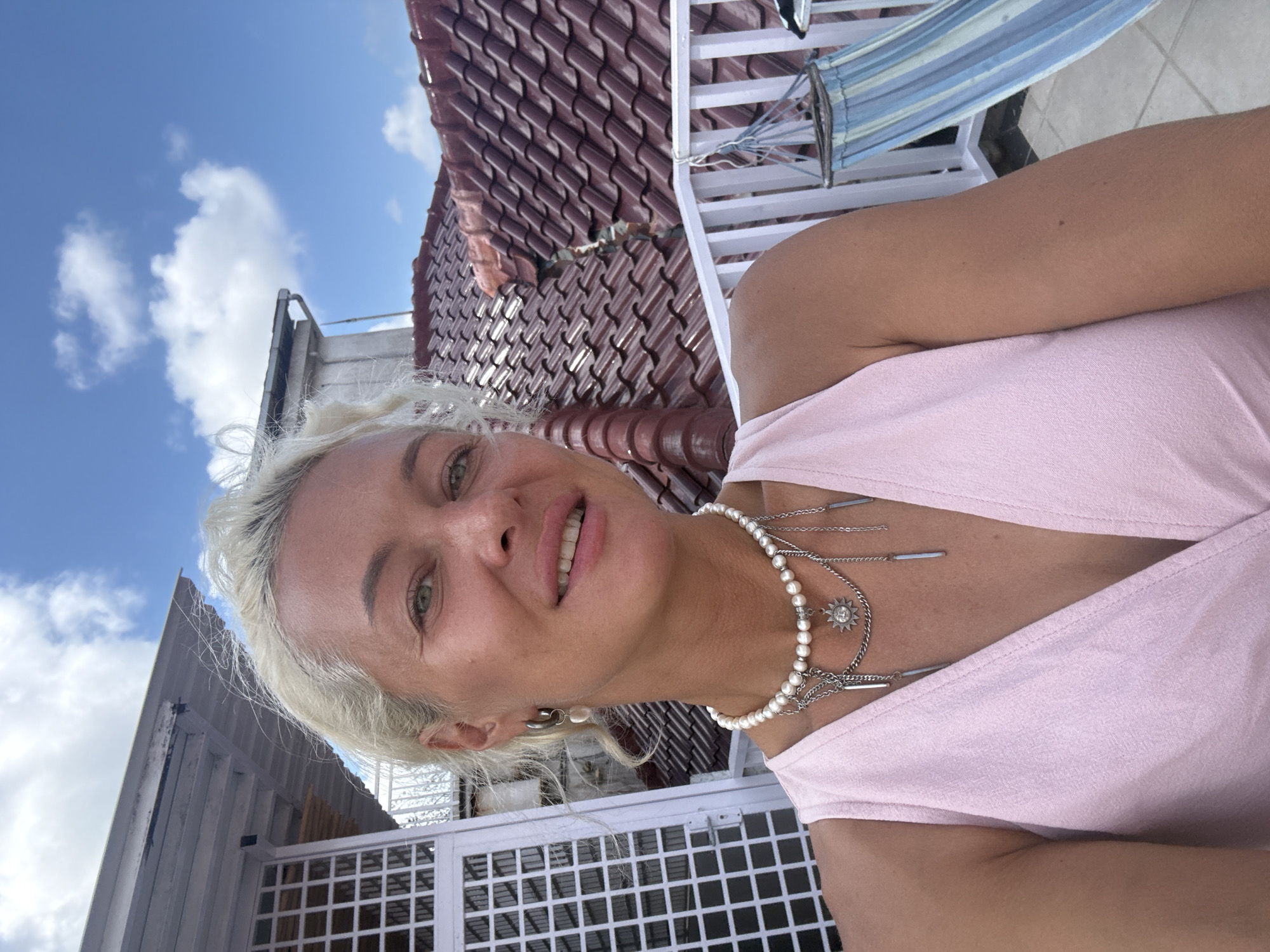 Woman takes selfie on balcony in early morning