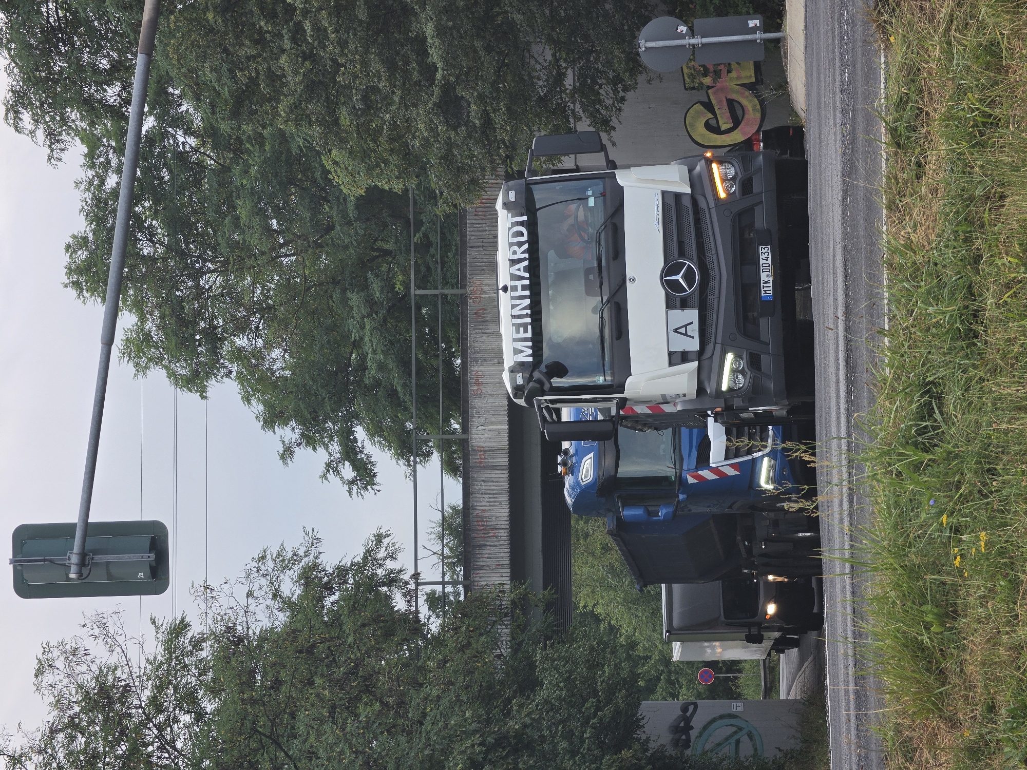 Freight trucks and riverside industry along Kelsterbach's cargo corridor