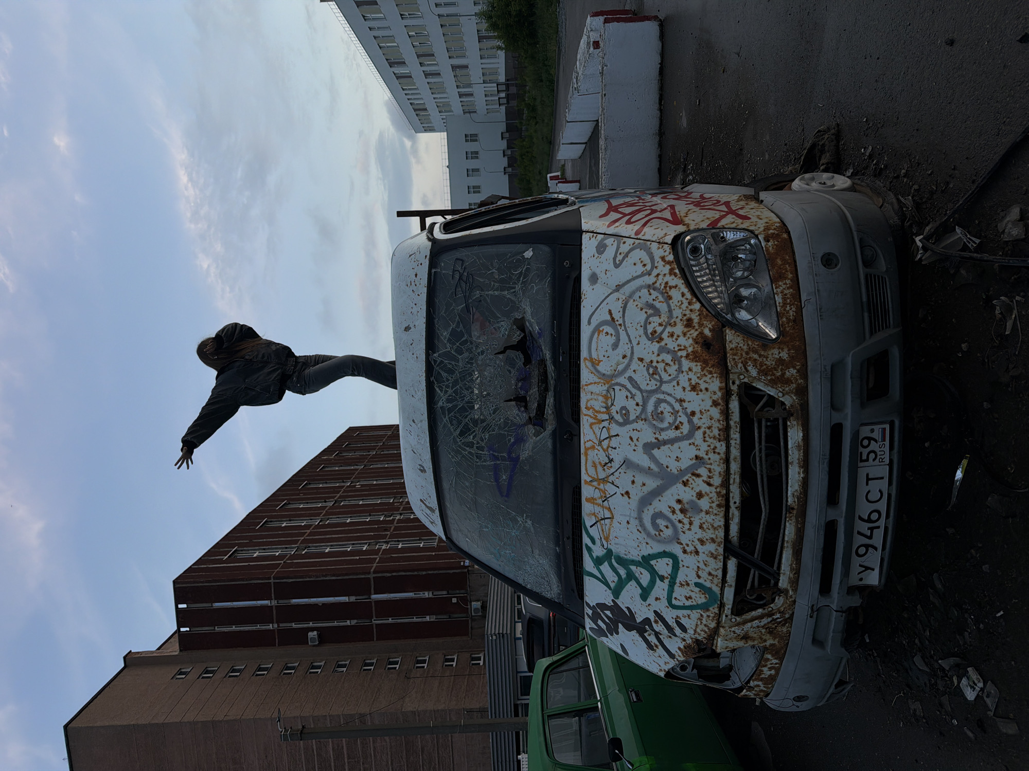 Young people gather around abandoned van in Perm