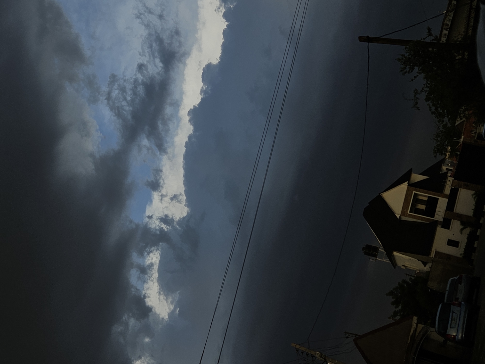 Storm clouds gather over Nigerian neighborhood as witness documents scenes