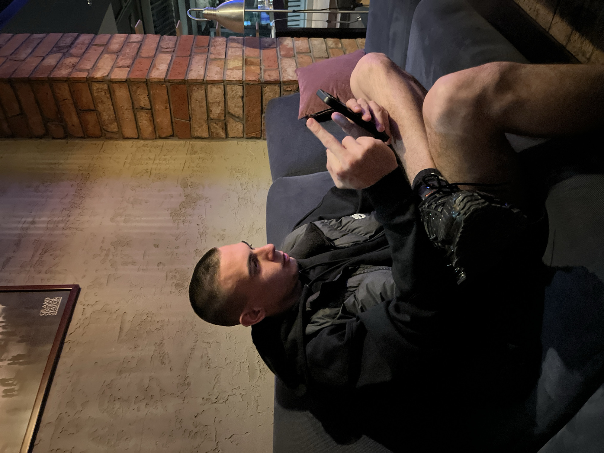 Young people socialize at dimly lit bar in Karlovo