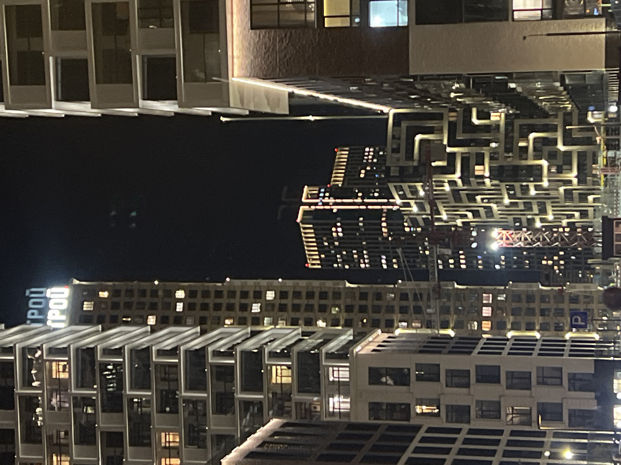 Moscow's illuminated modern skyline captured in evening observations