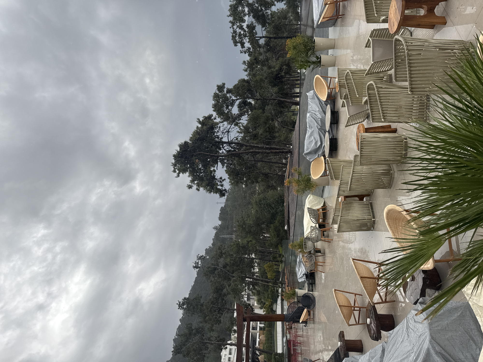 Restaurant patio furniture covered during cloudy weather in Bodrum