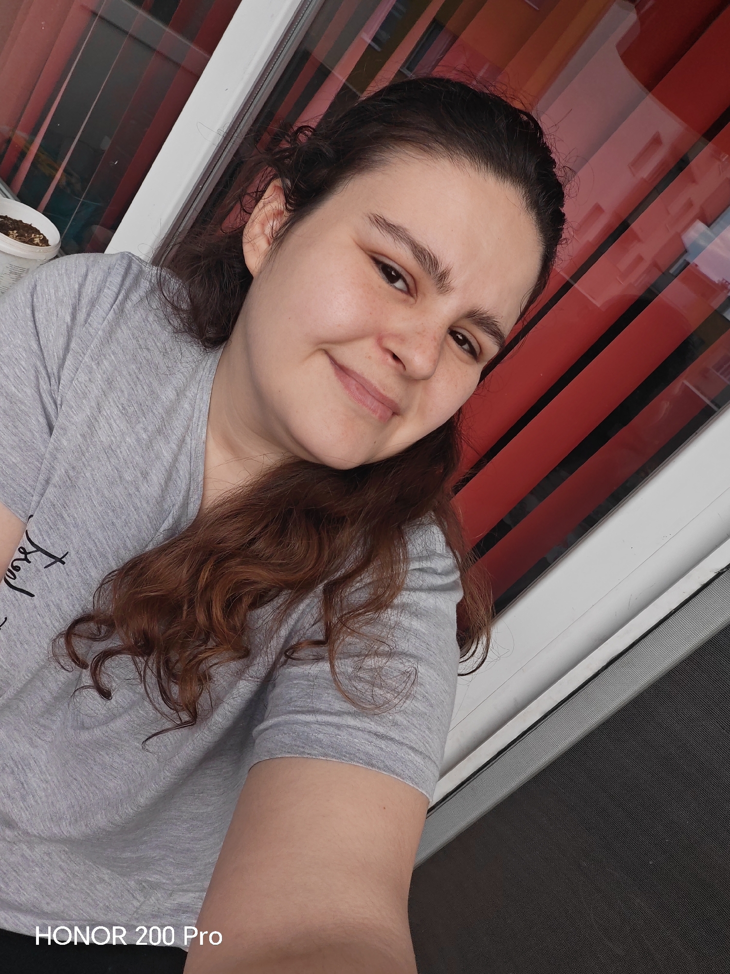 Woman takes indoor selfie near window in Haskovo Bulgaria