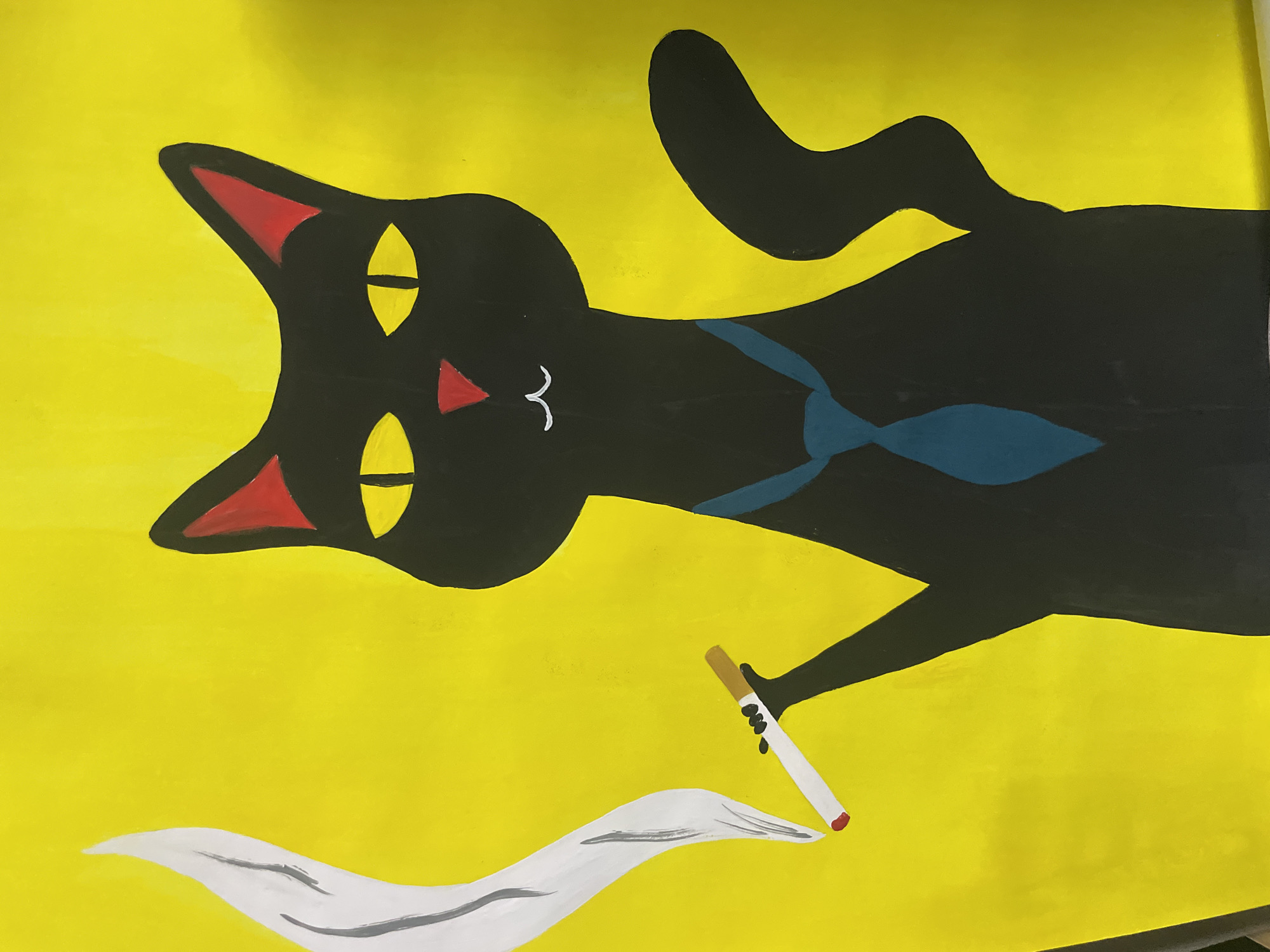 Artist's black cat observed during painting session in Chaikovsky