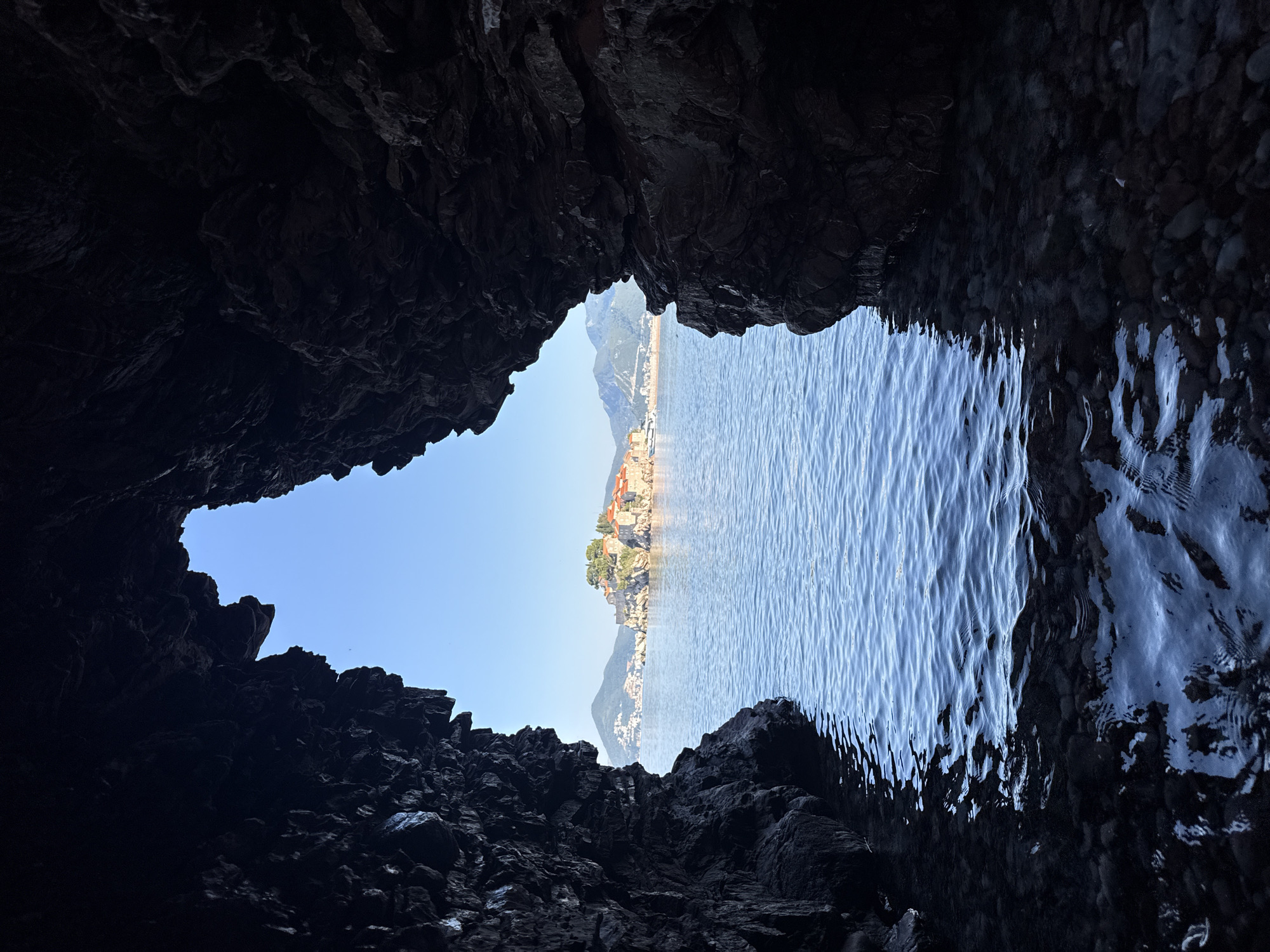 Budva coastline at dawn: caves, arches, and Sveti Stefan views