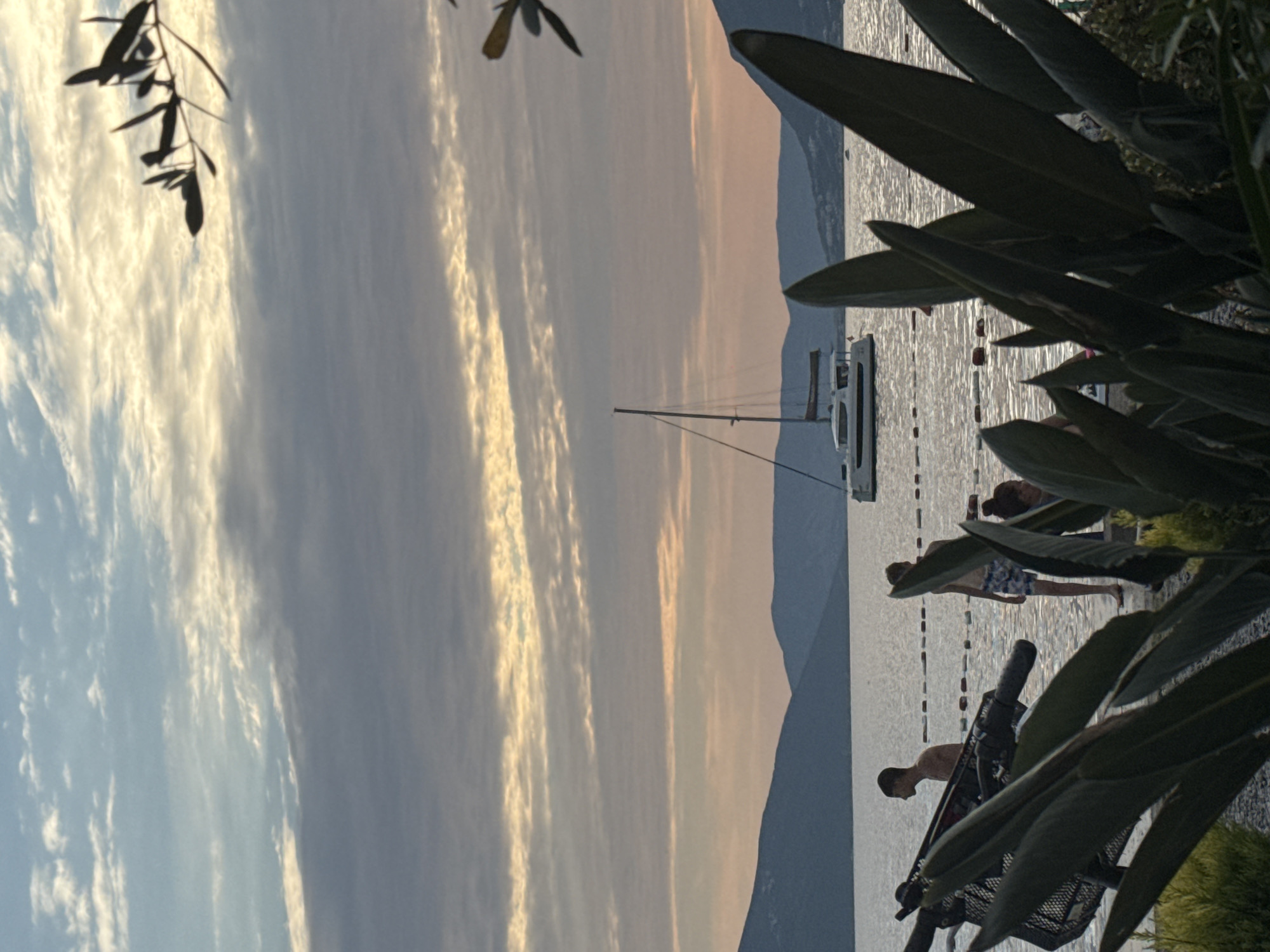 Coastal dusk sky, soft gradients and wispy clouds at sunset