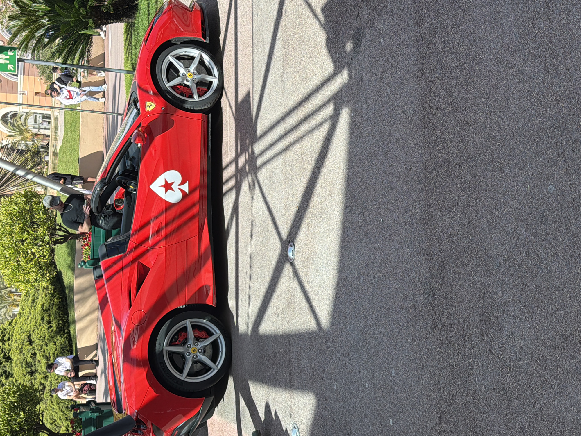 Red Ferrari with white spade spotted parked in Monaco
