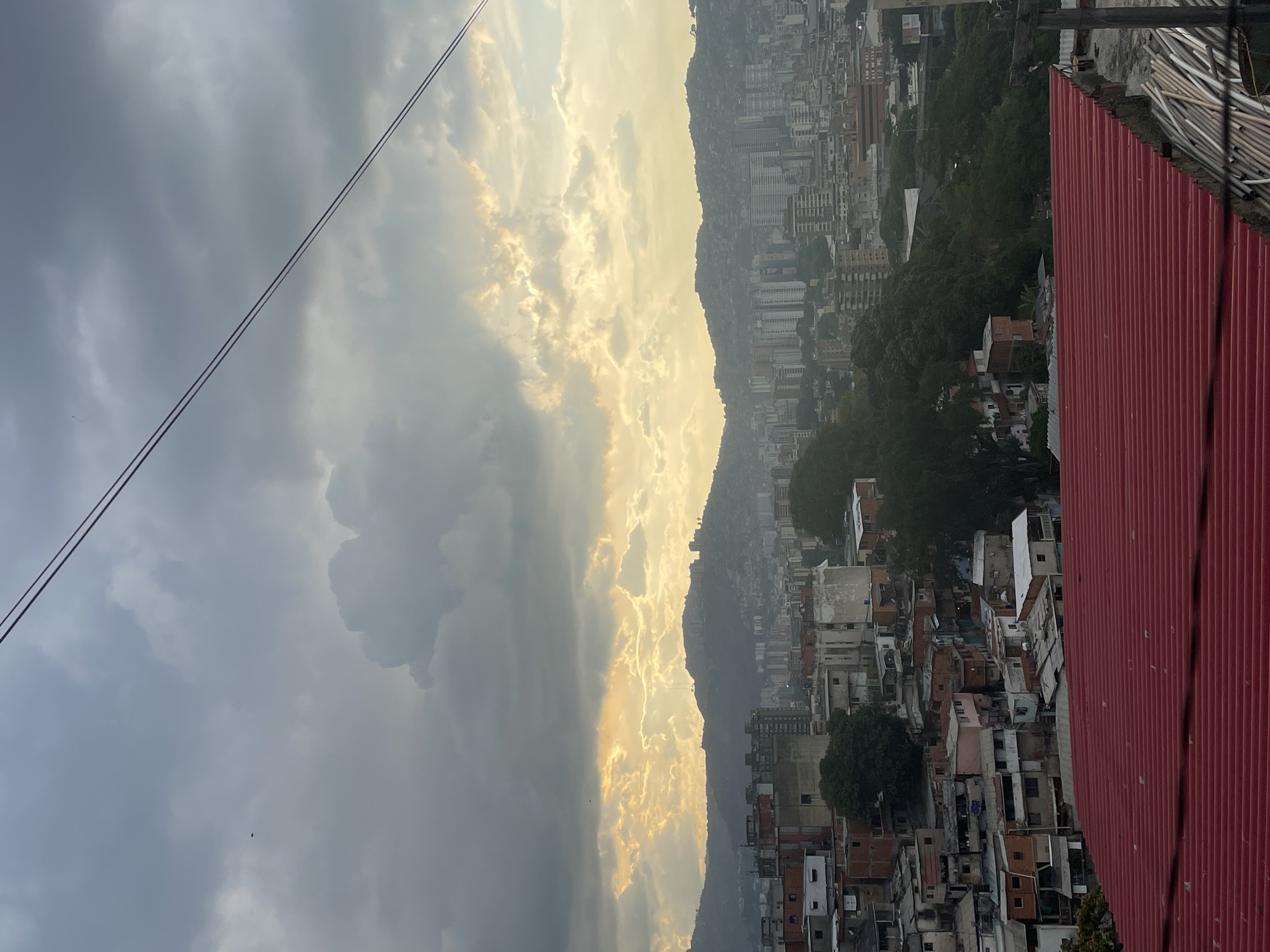 Urban skyline photographed under dramatic evening clouds