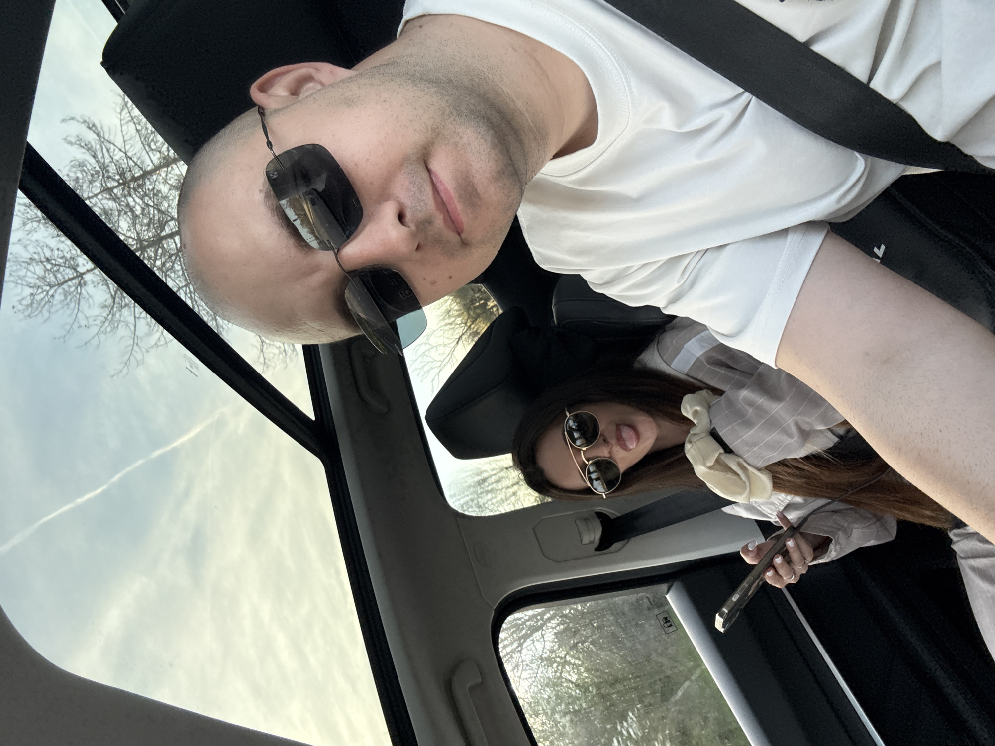 Couple takes selfies in car in Pobeda, Bulgaria