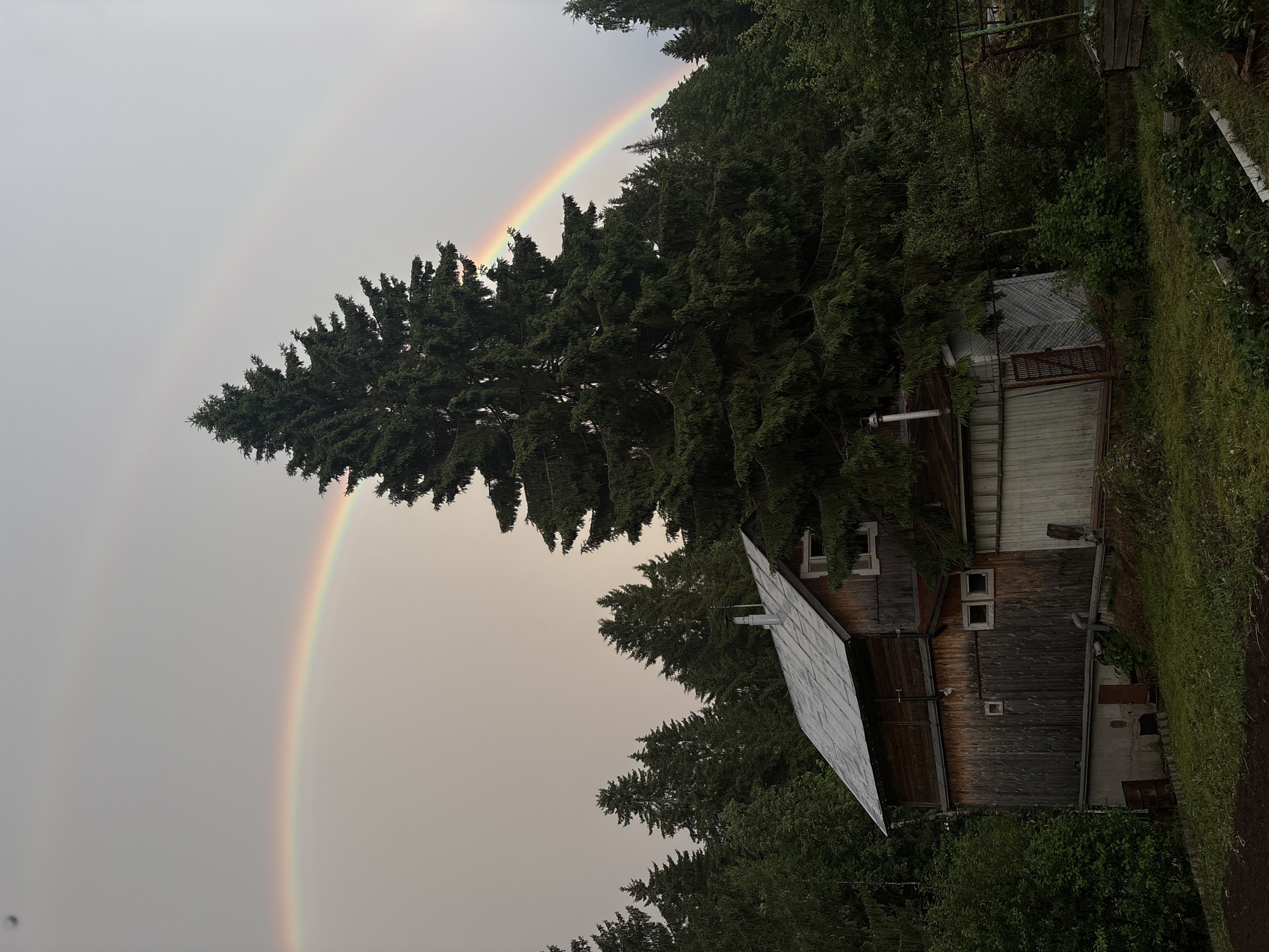 Double rainbow captured over rural Zhebrei, Russia