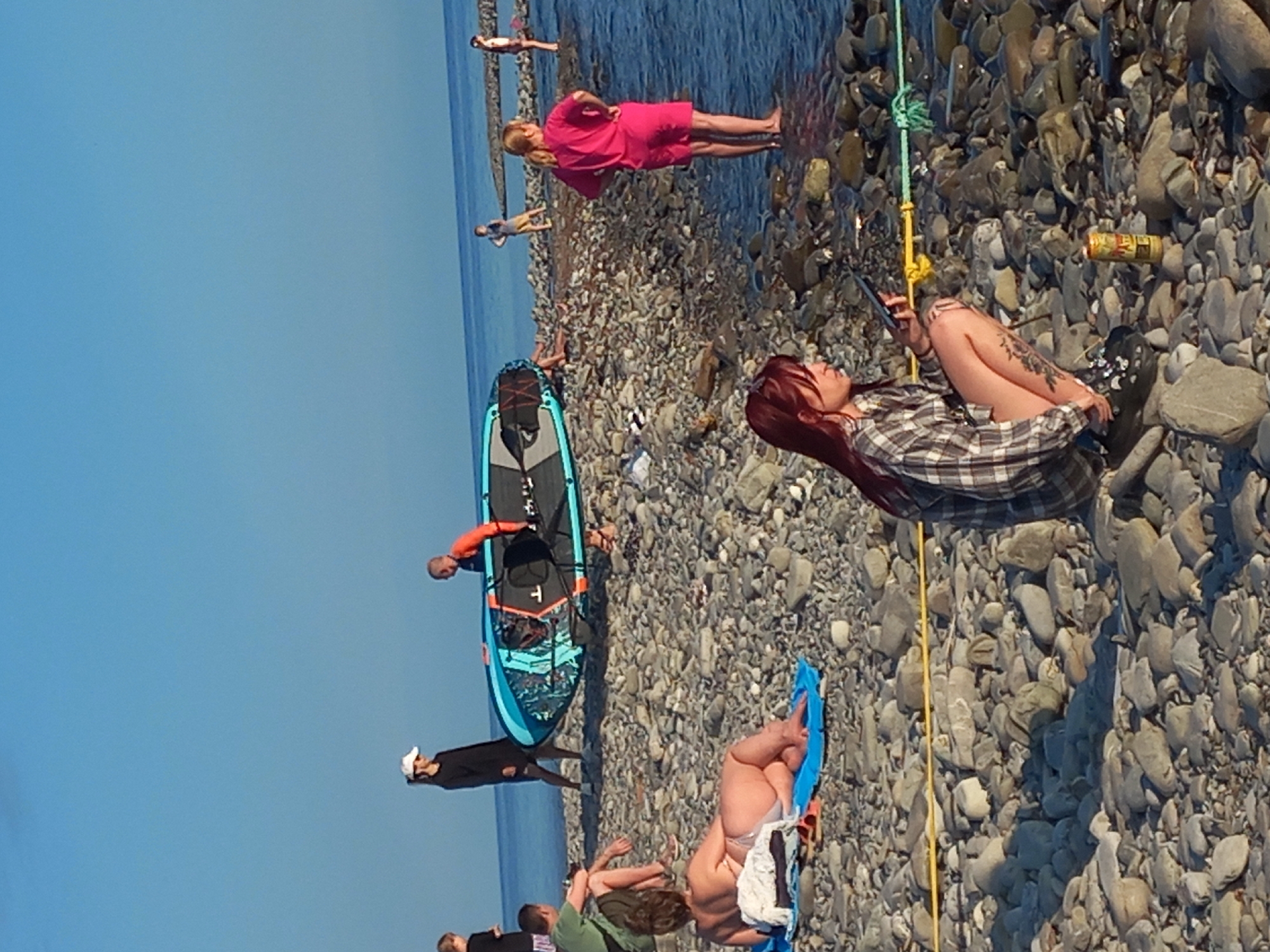Beach activities observed in Sochi during summer afternoon