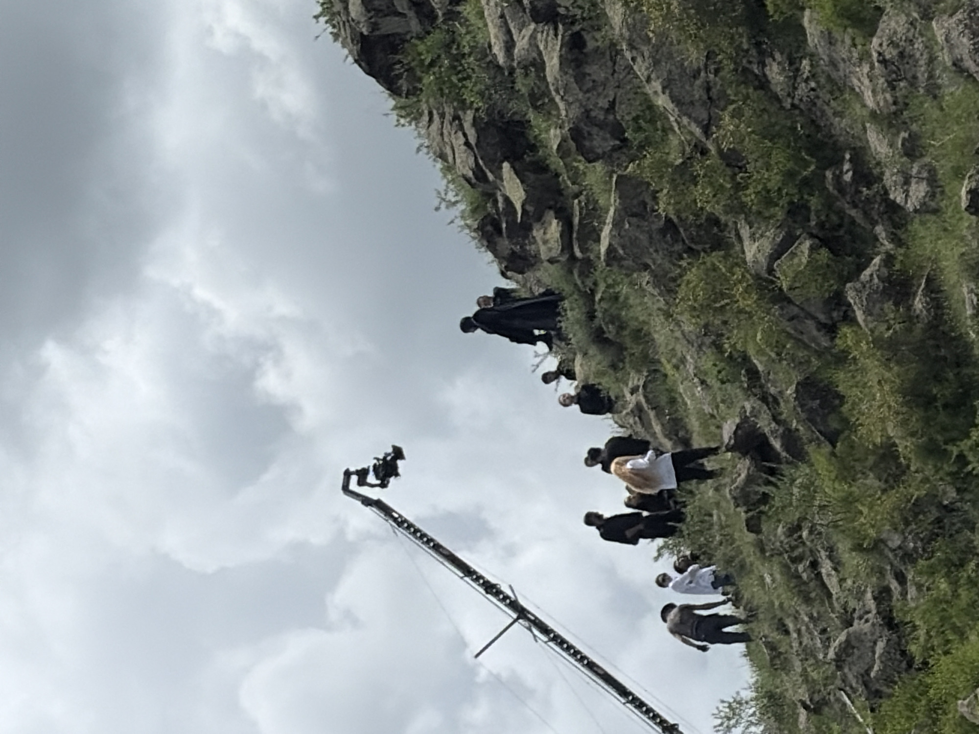 Film crew shoots on rocky hillside in Armenia