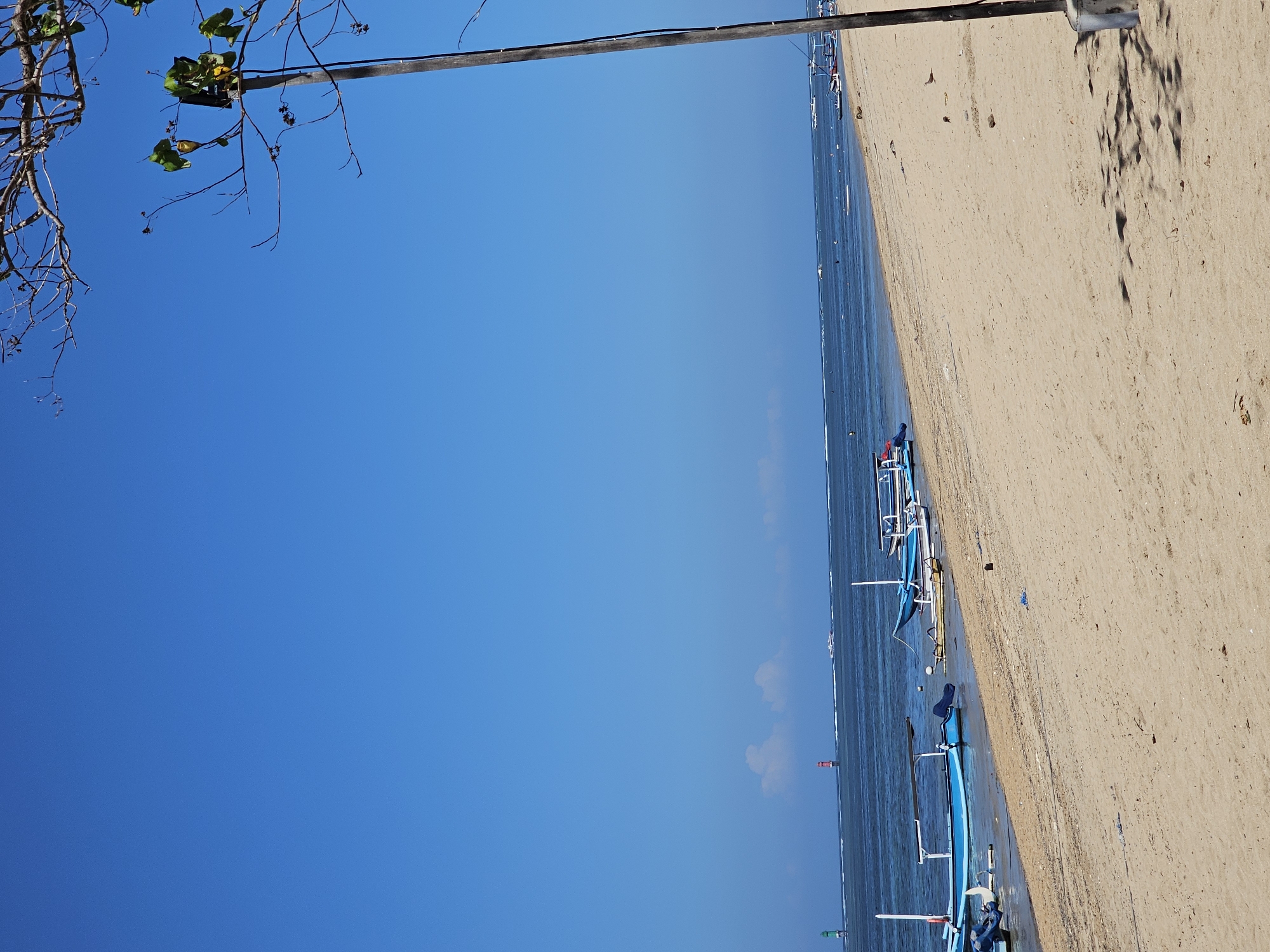 Sanur Beach on a busy Bali morning — sun, sand, and street life