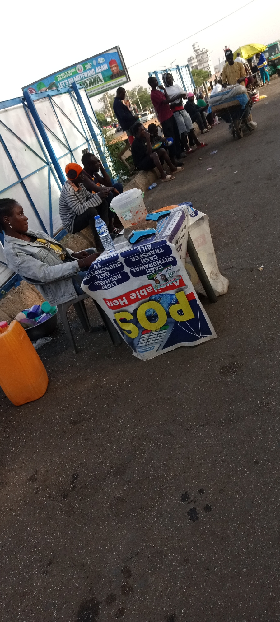 Street vendors conduct afternoon business in Jos, Nigeria
