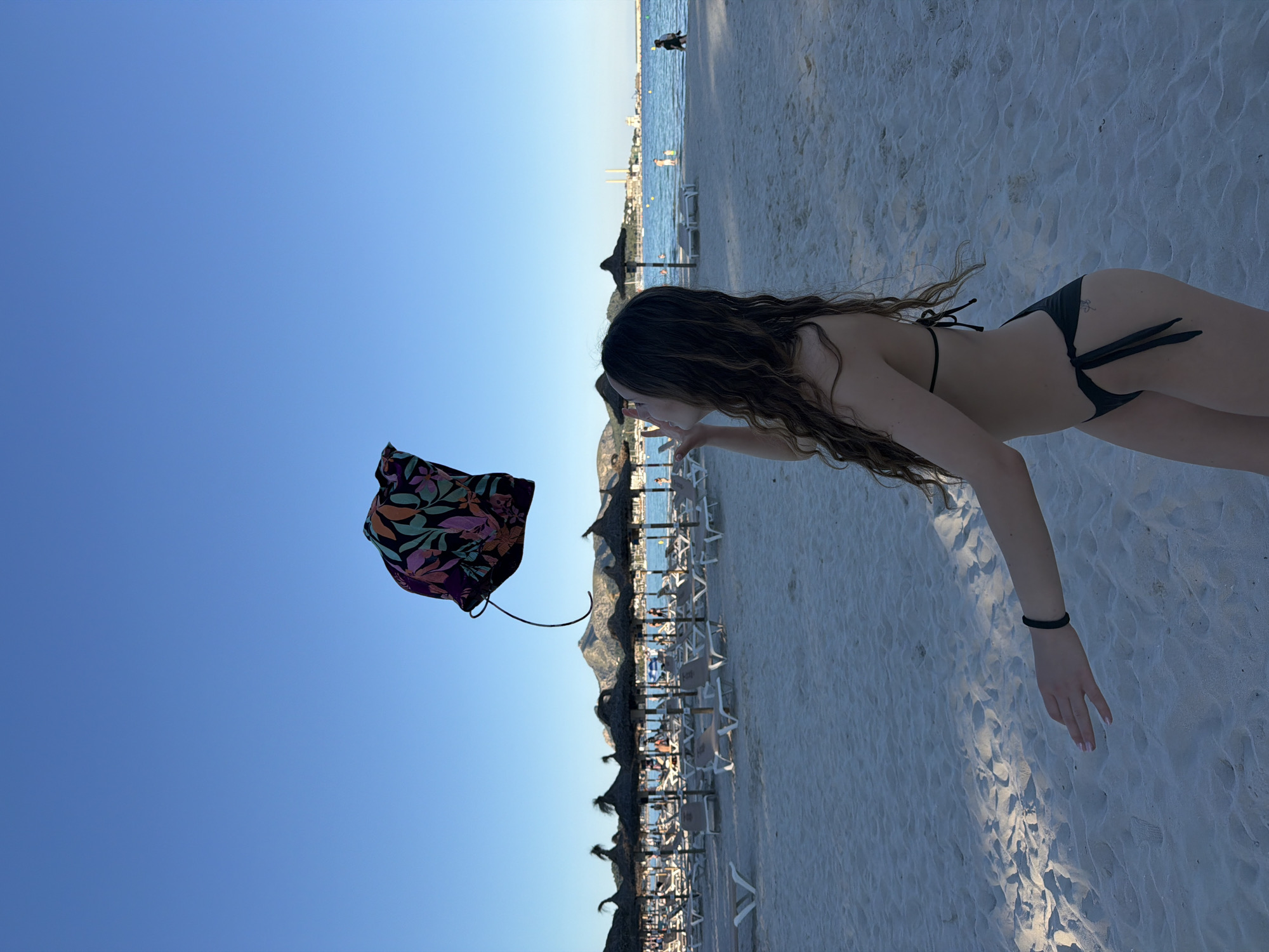 Woman enjoys sunny afternoon at Alcúdia beach in Spain