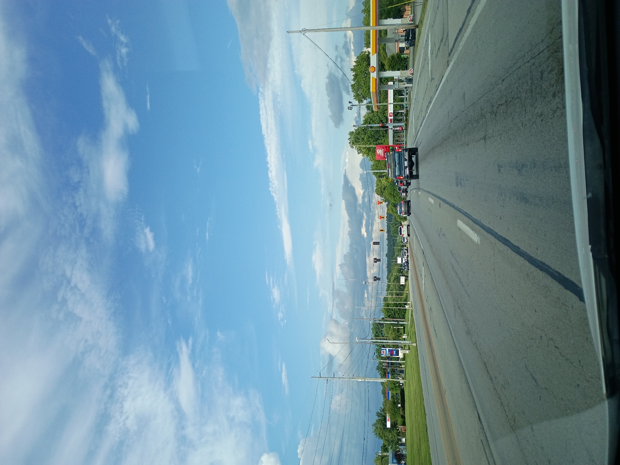 Evening highway drive through Versailles, Kentucky skies