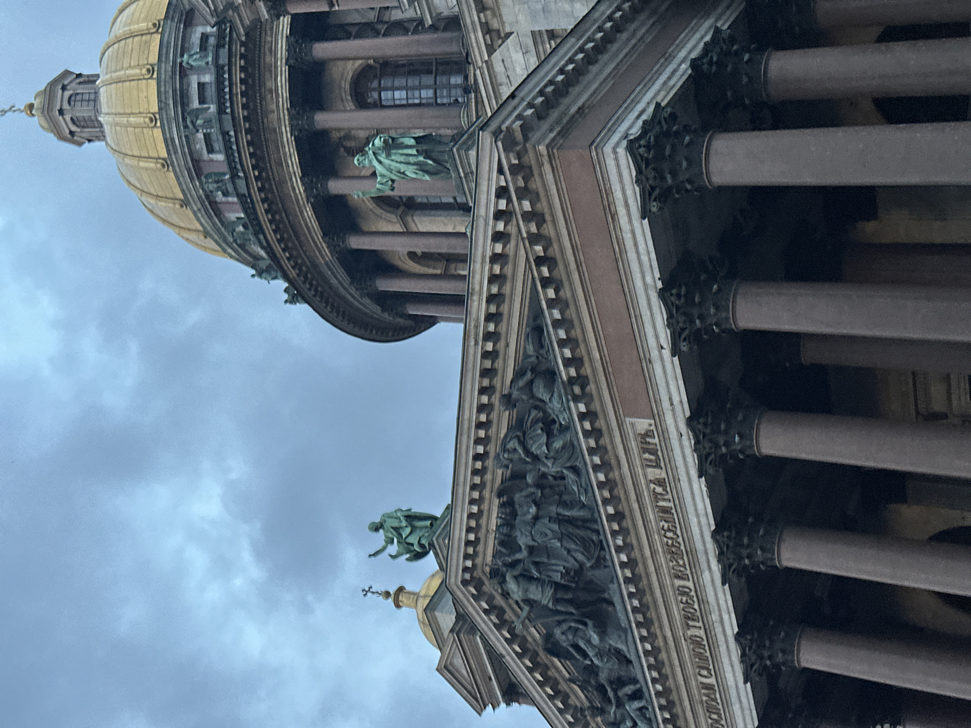 St. Isaac's golden dome under cloudy Saint Petersburg skies
