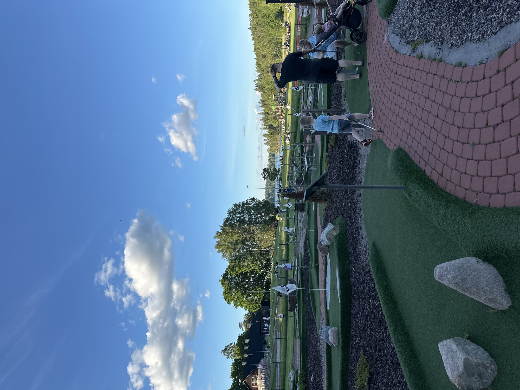 Afternoon at a recreational park: mini-golf, kites, and lake views