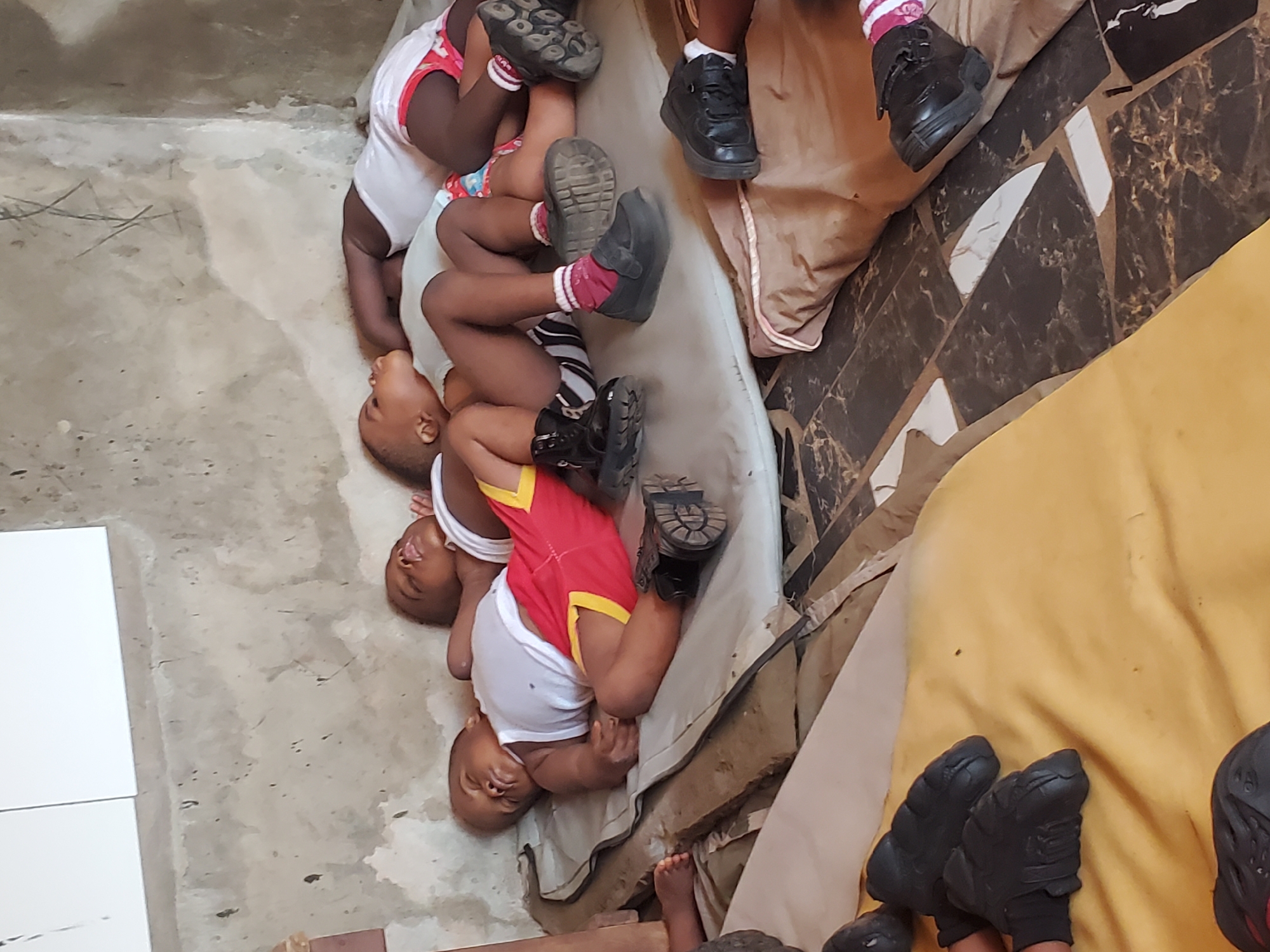 Children rest during midday in Nigerian schools and homes