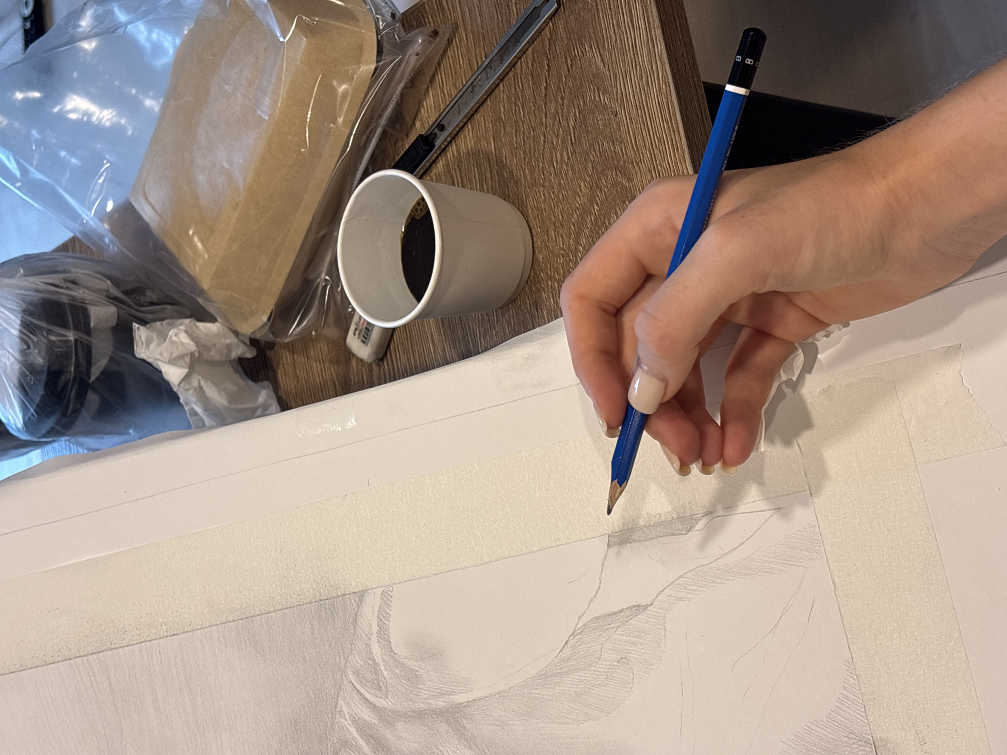Artist creates intimate pencil drawing in Choeng Thale workspace