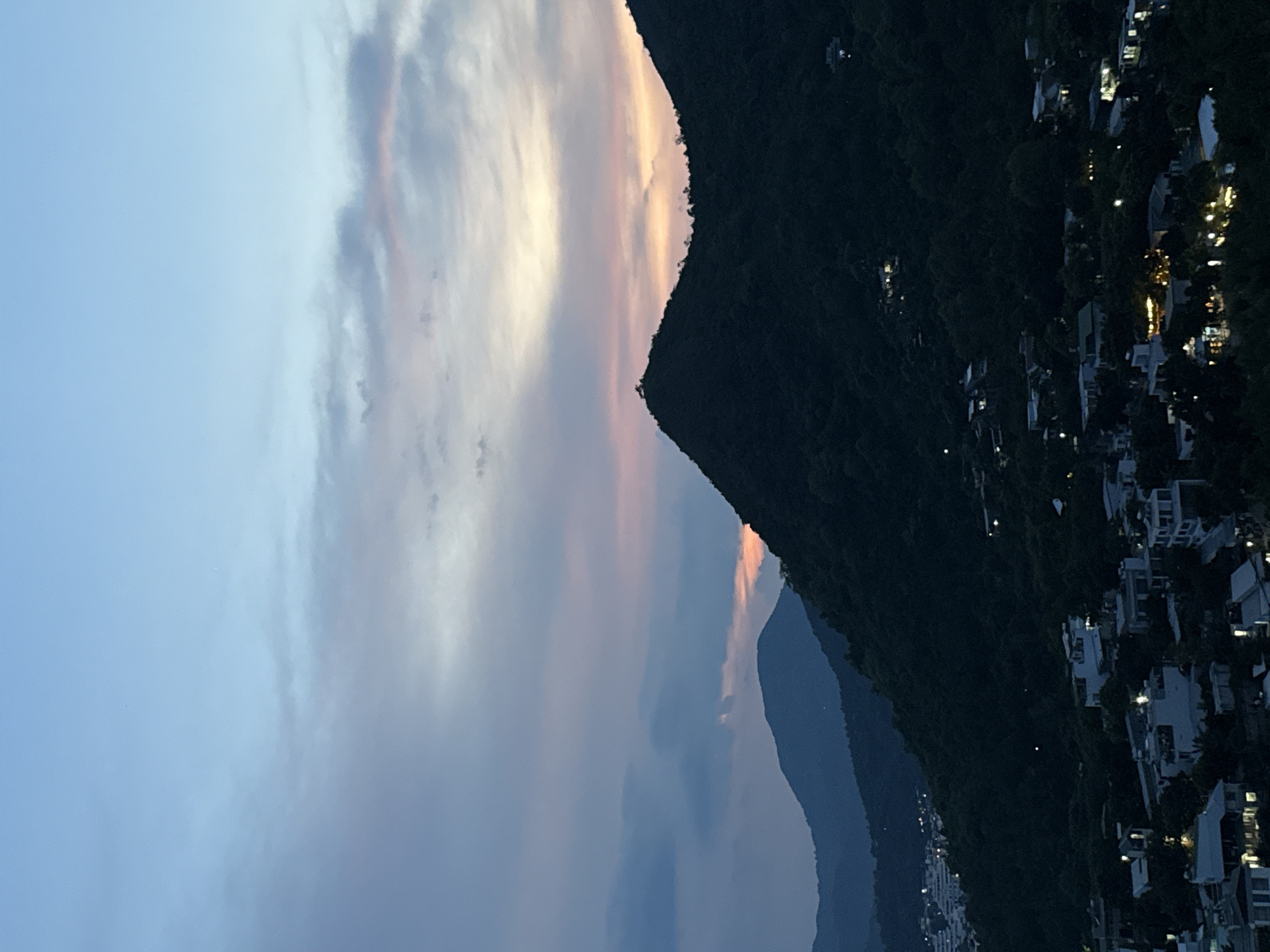 Sunset sweeps over Nha Trang's green hills and coastal sprawl