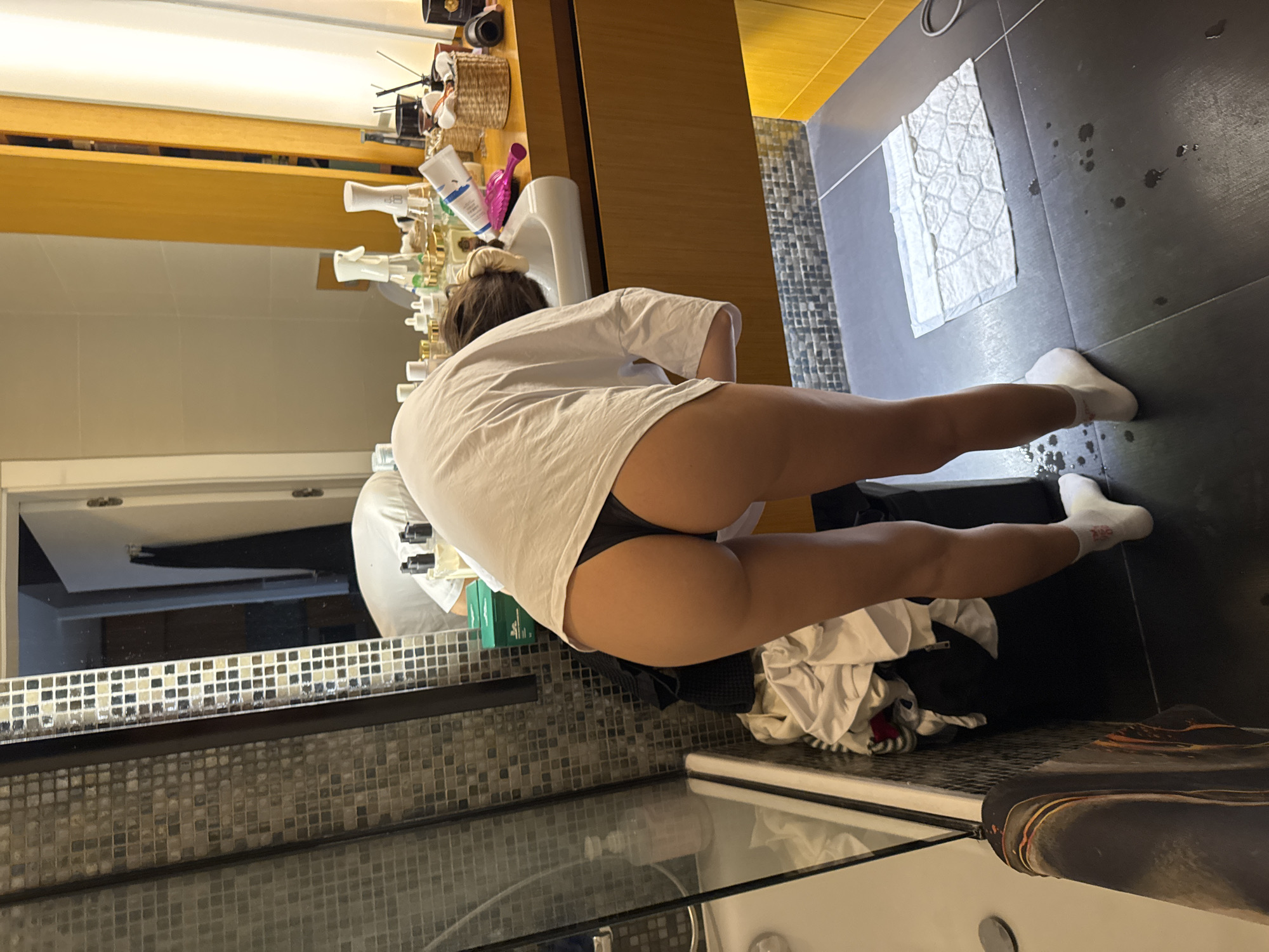 Woman documented in apartment during evening routine activities