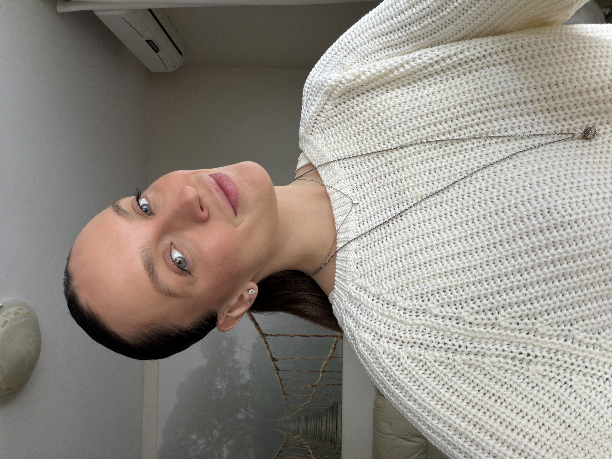 Woman takes selfies indoors in Budva, Montenegro