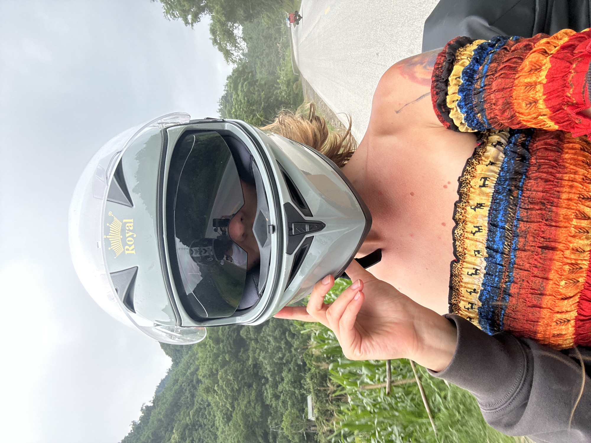 Motorcyclist takes selfies in colorful dress in Vietnam