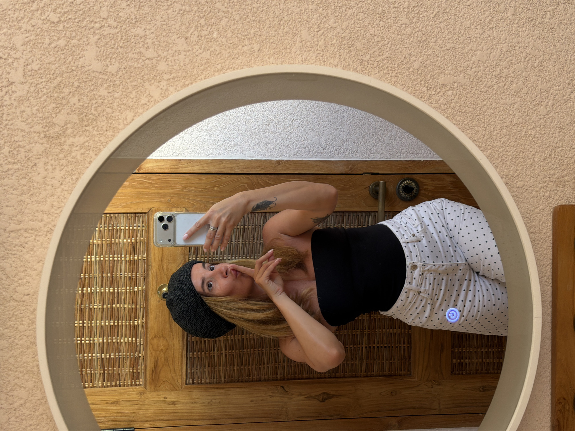Hotel mirror selfies in Mengwi, same outfit, multiple angles