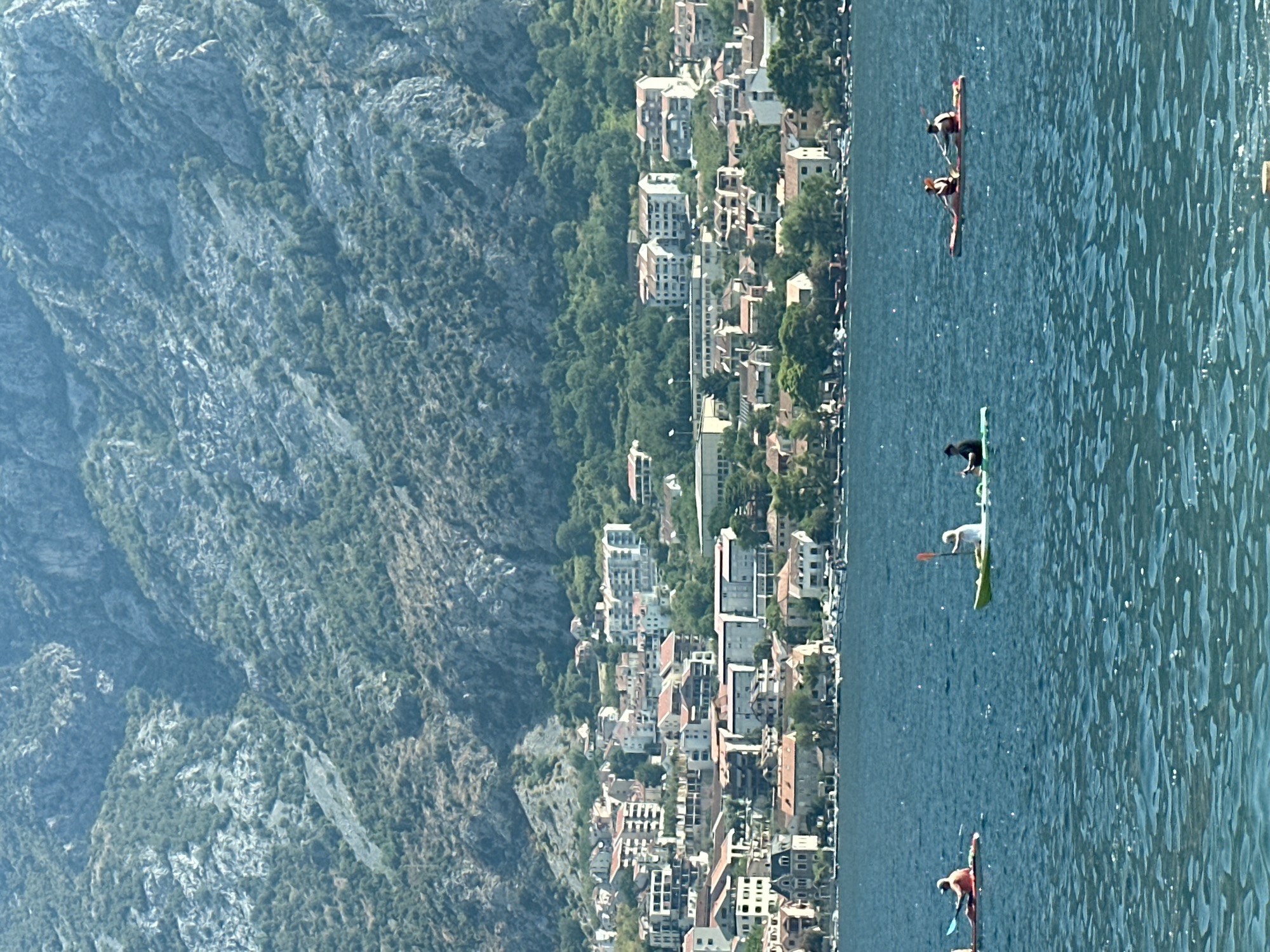 Cruise ship moves through Bay of Kotor past Prčanj