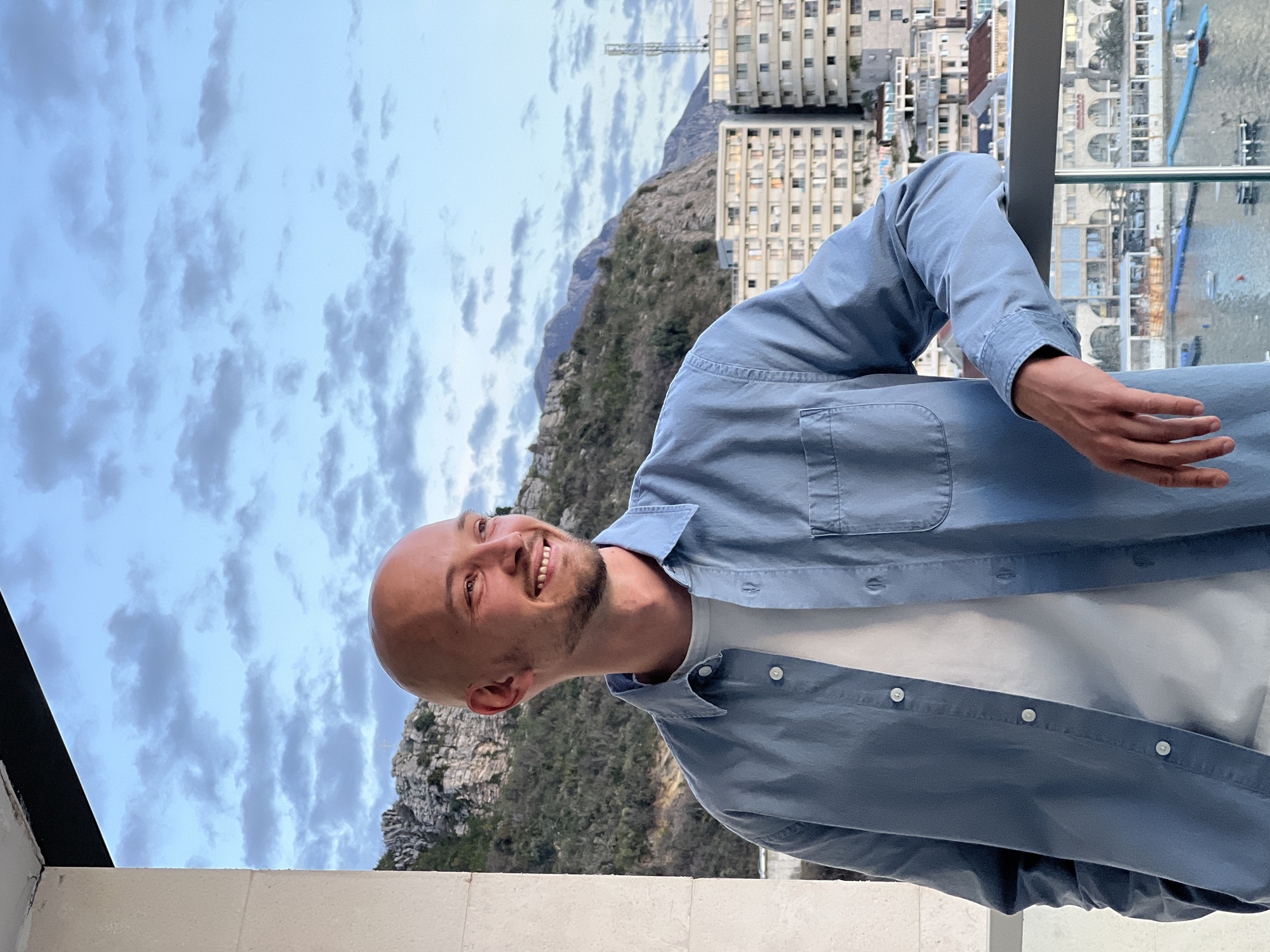 Man photographed on balcony overlooking Adriatic coast Montenegro
