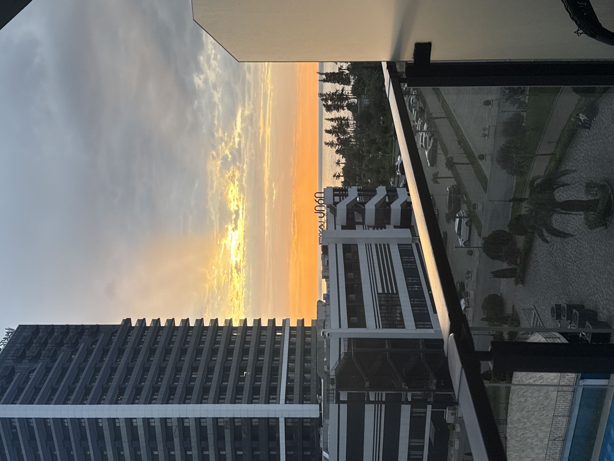 Batumi sunset documented from high-rise balcony overlooking Black Sea