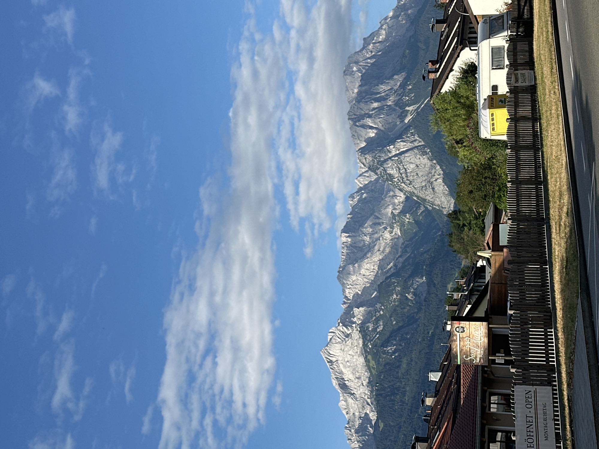 Morning drive through Garmisch-Partenkirchen with alpine views and a croissant