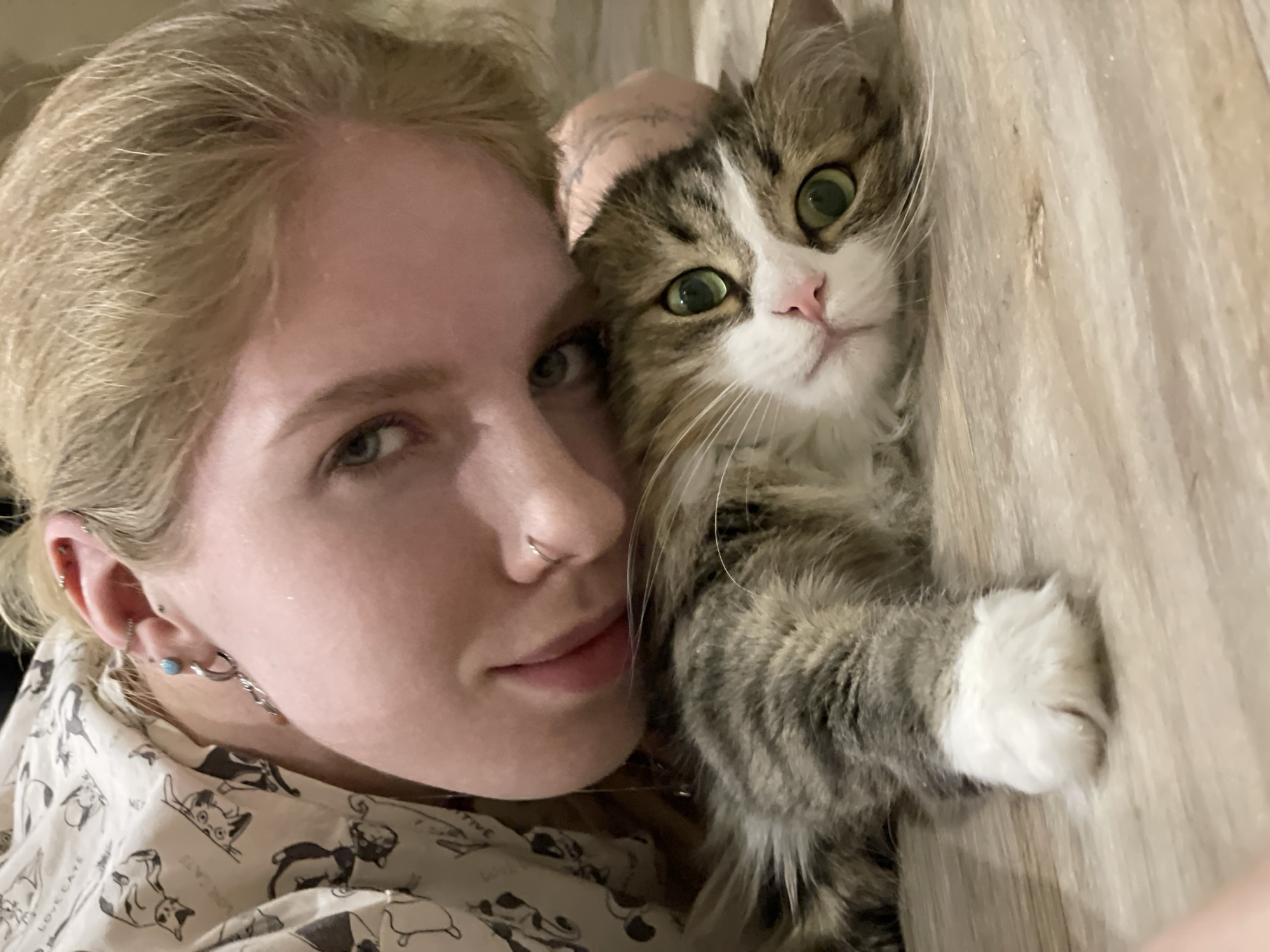Woman and cat share quiet moment in Izhevsk apartment