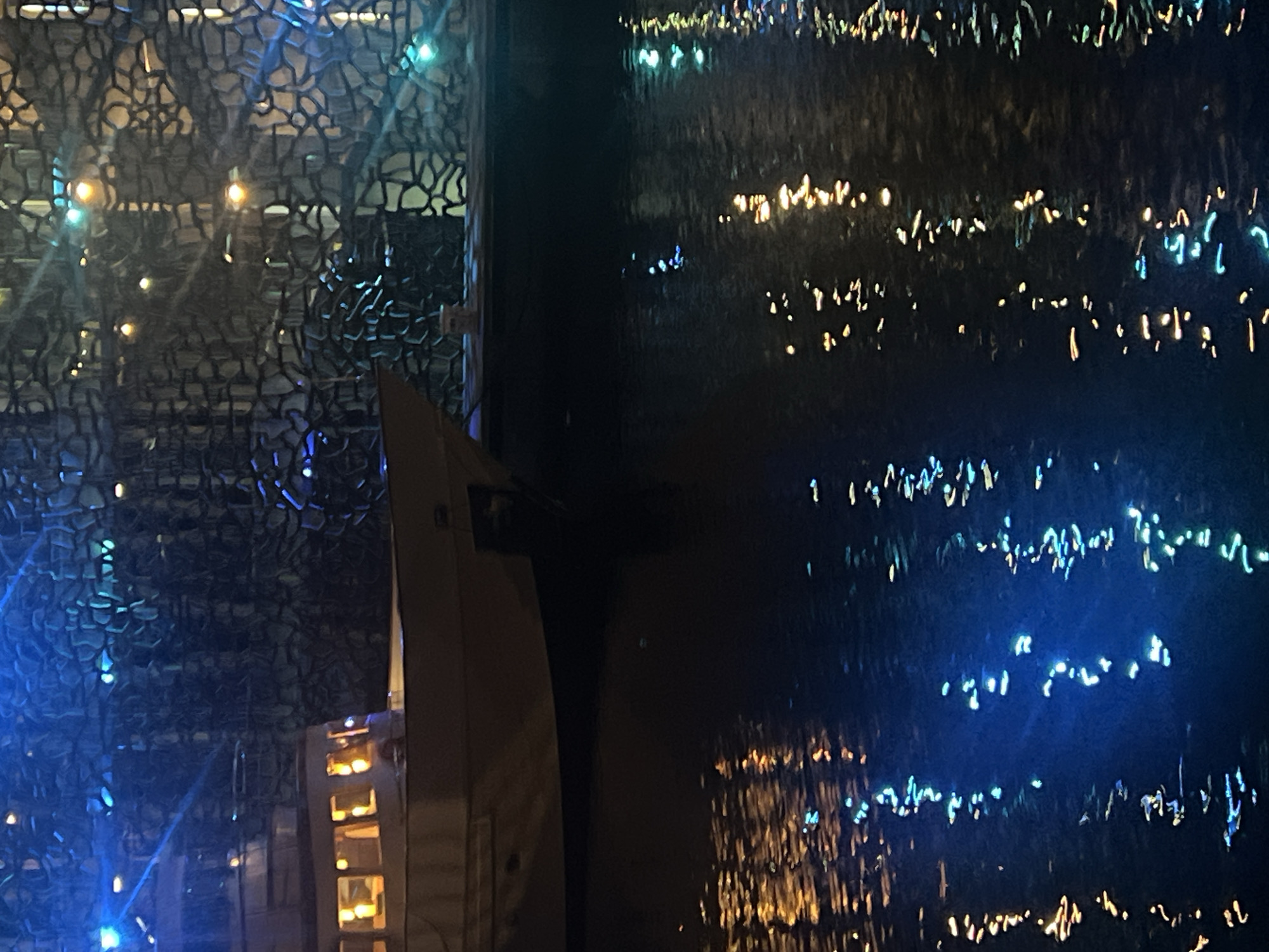 Evening gathering at Marseille's illuminated Mucem waterfront draws dancers