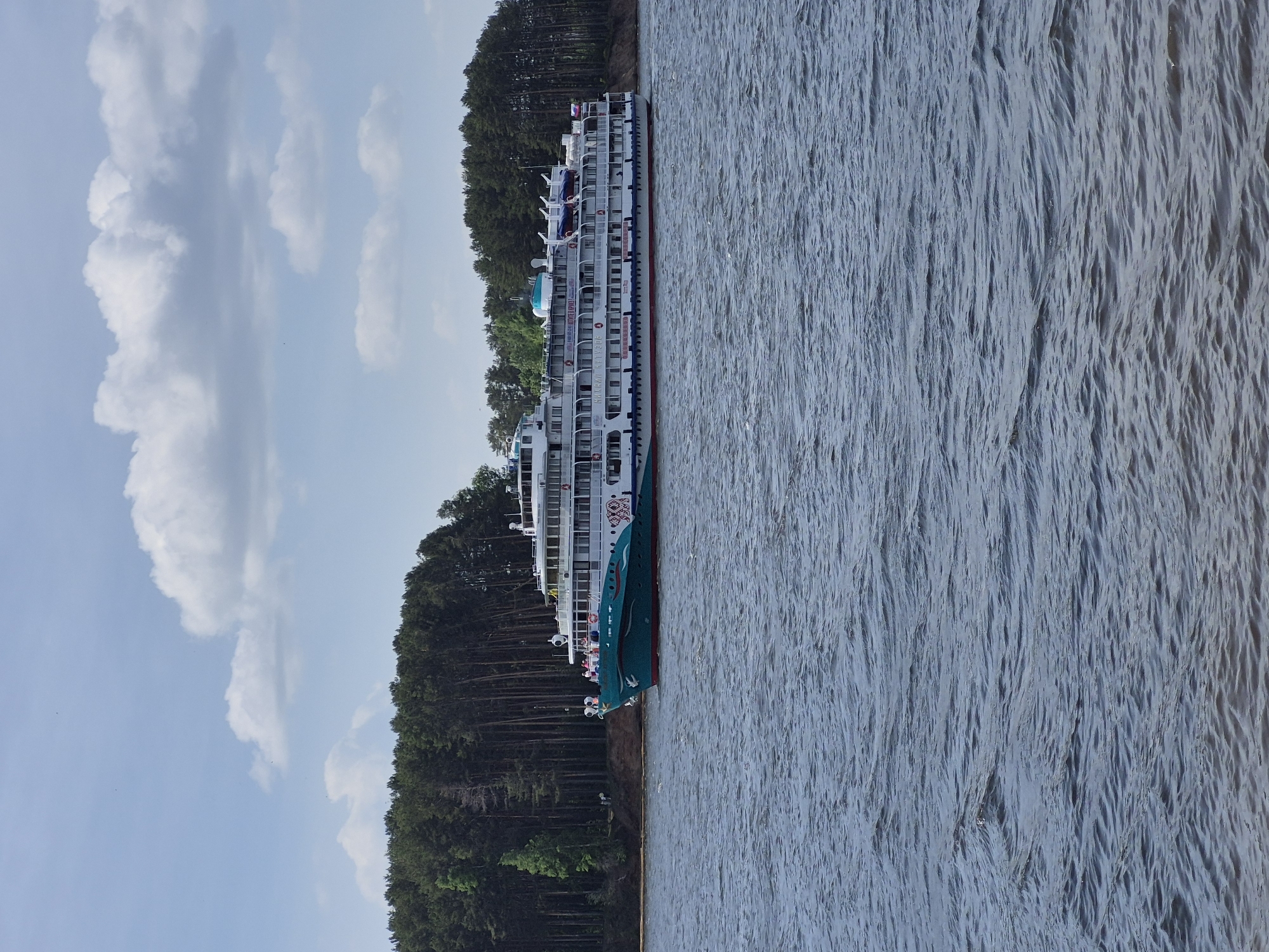 Couple documents romantic visit to Chaikovsky waterfront, cruise ships docked