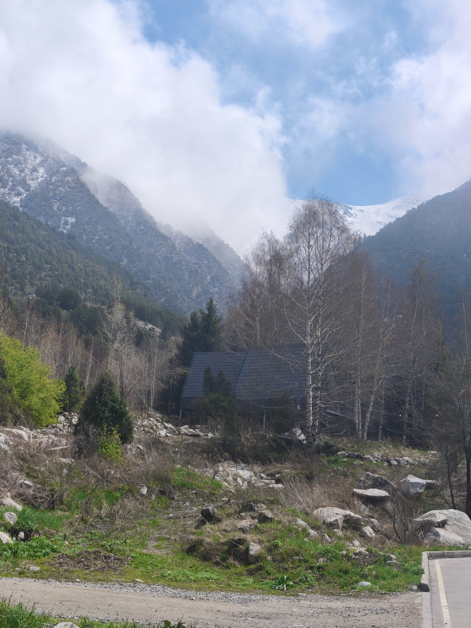 Rural building observed among trees near Kashka Suu, Kyrgyzstan