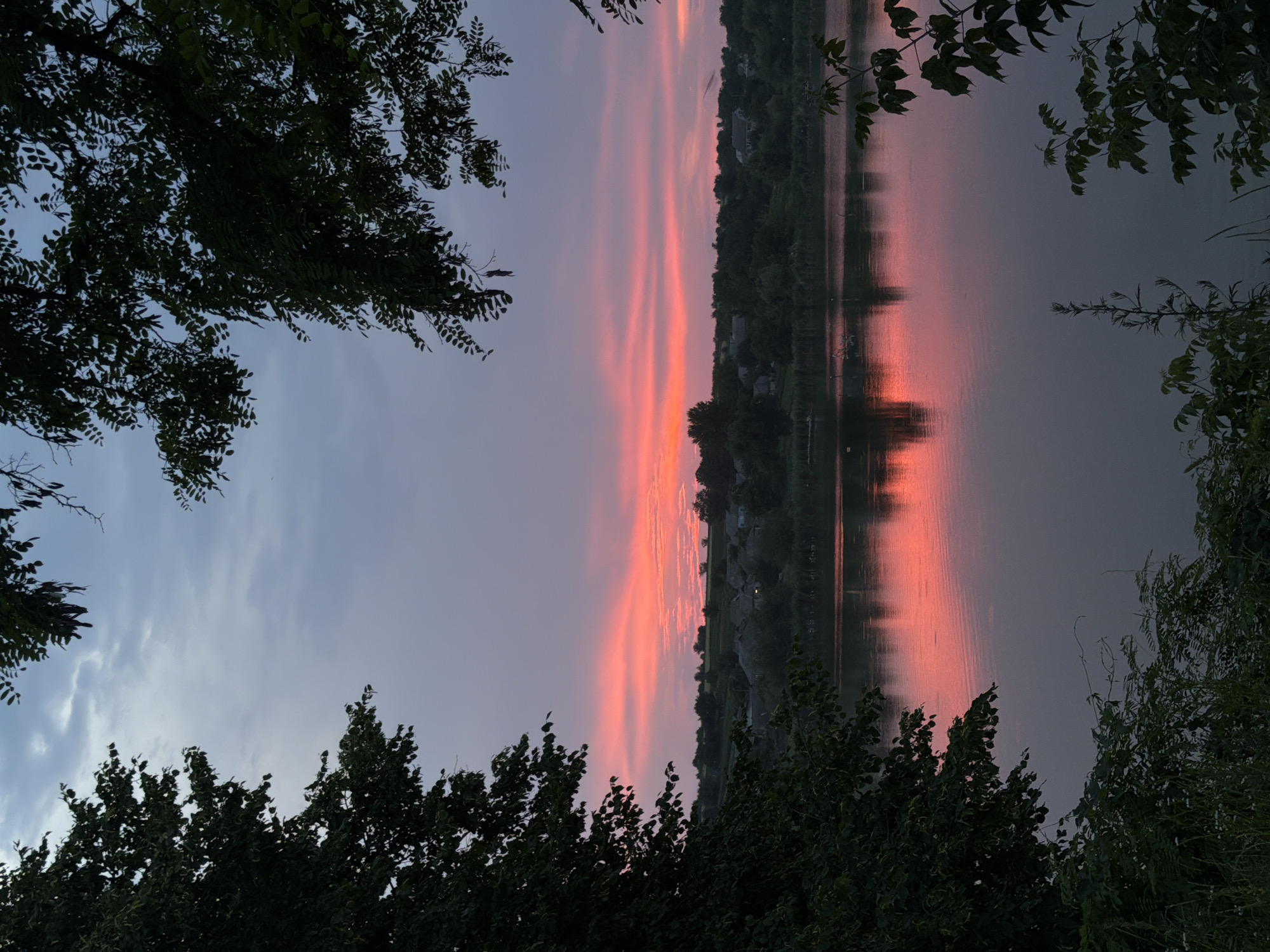 Dusk skies, still water, and worn rural buildings