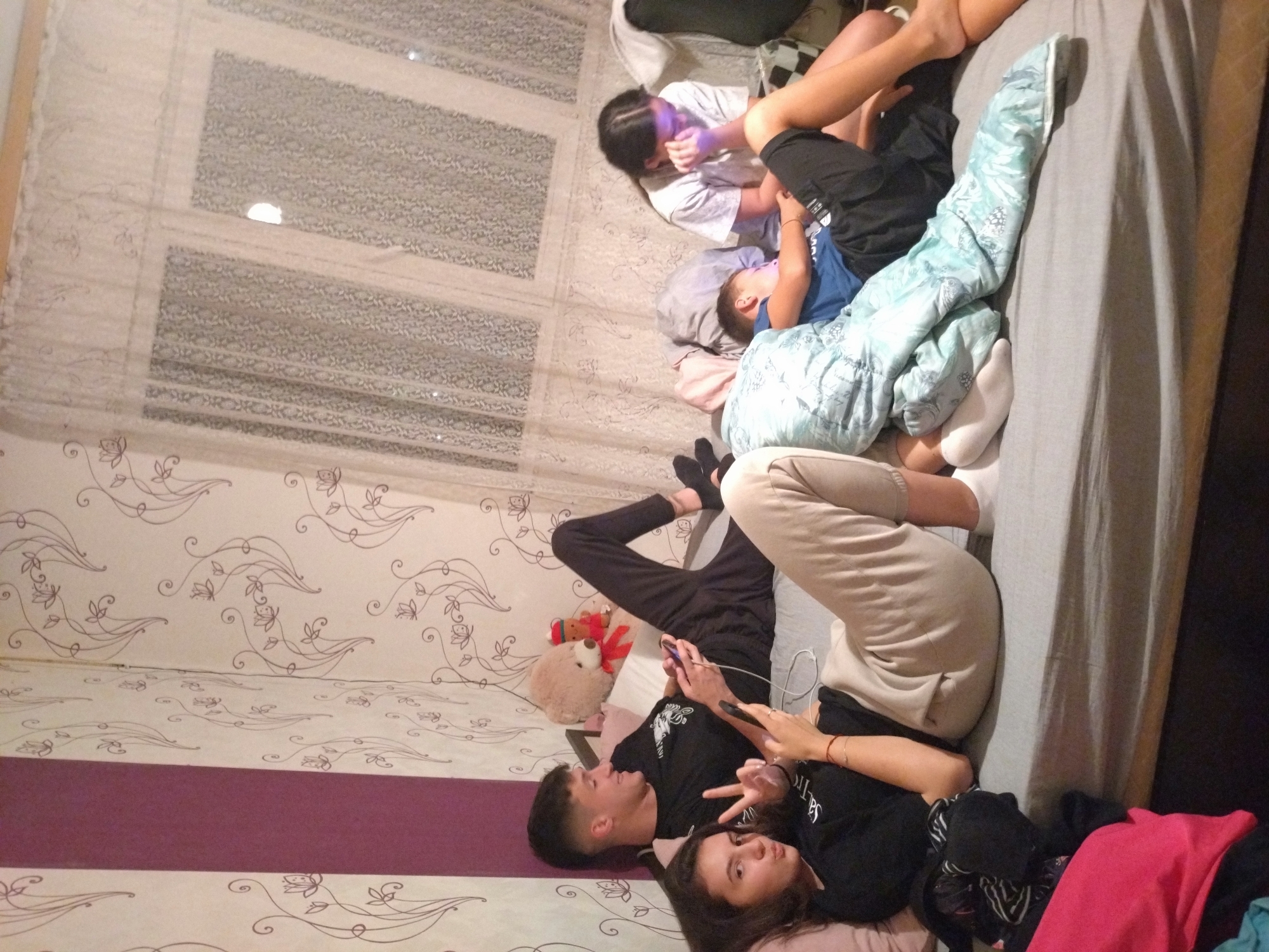Multiple people gathered in Stara Zagora bedroom scene