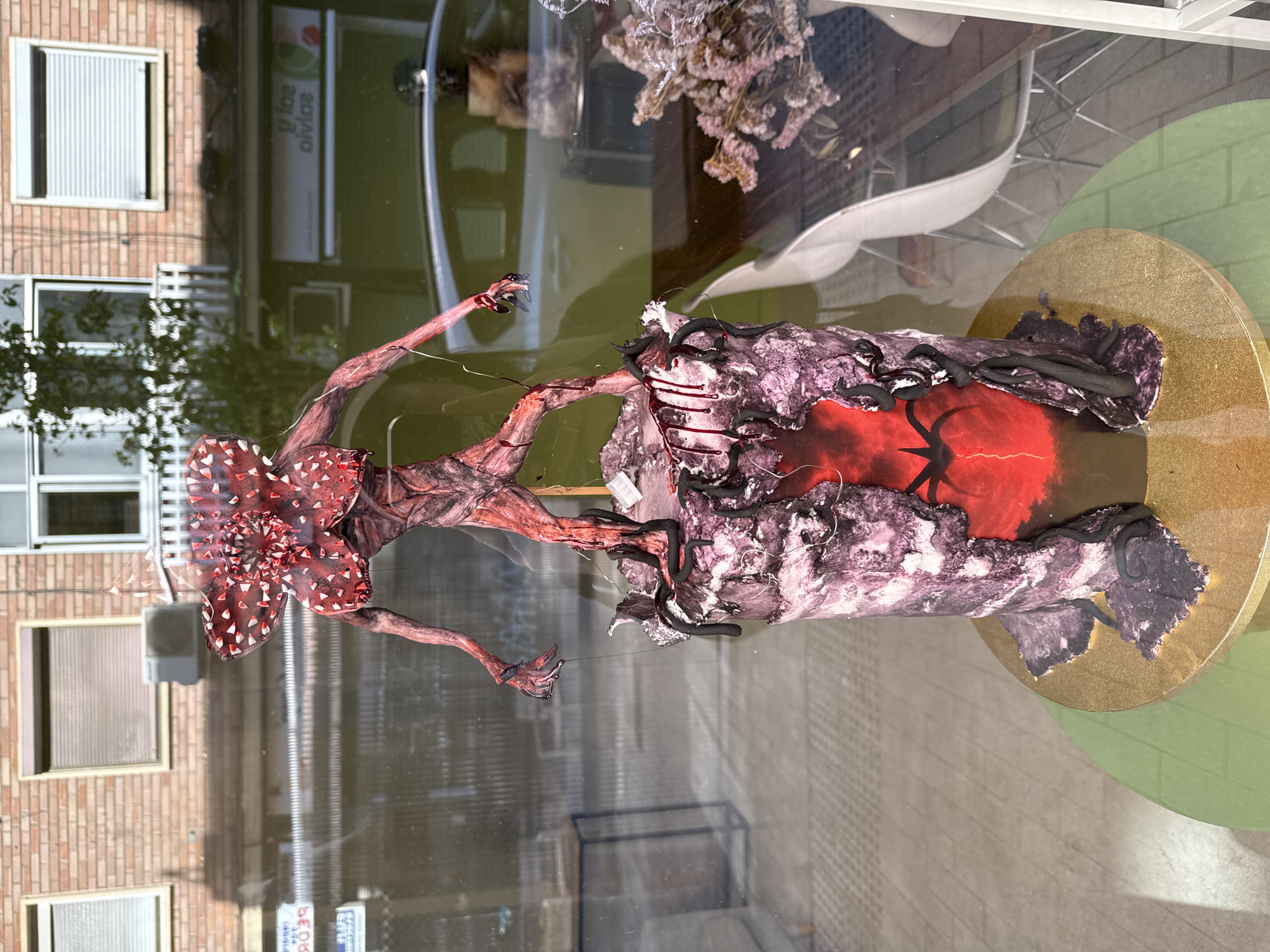 Urban scenes documented in Barcelona including TV character display