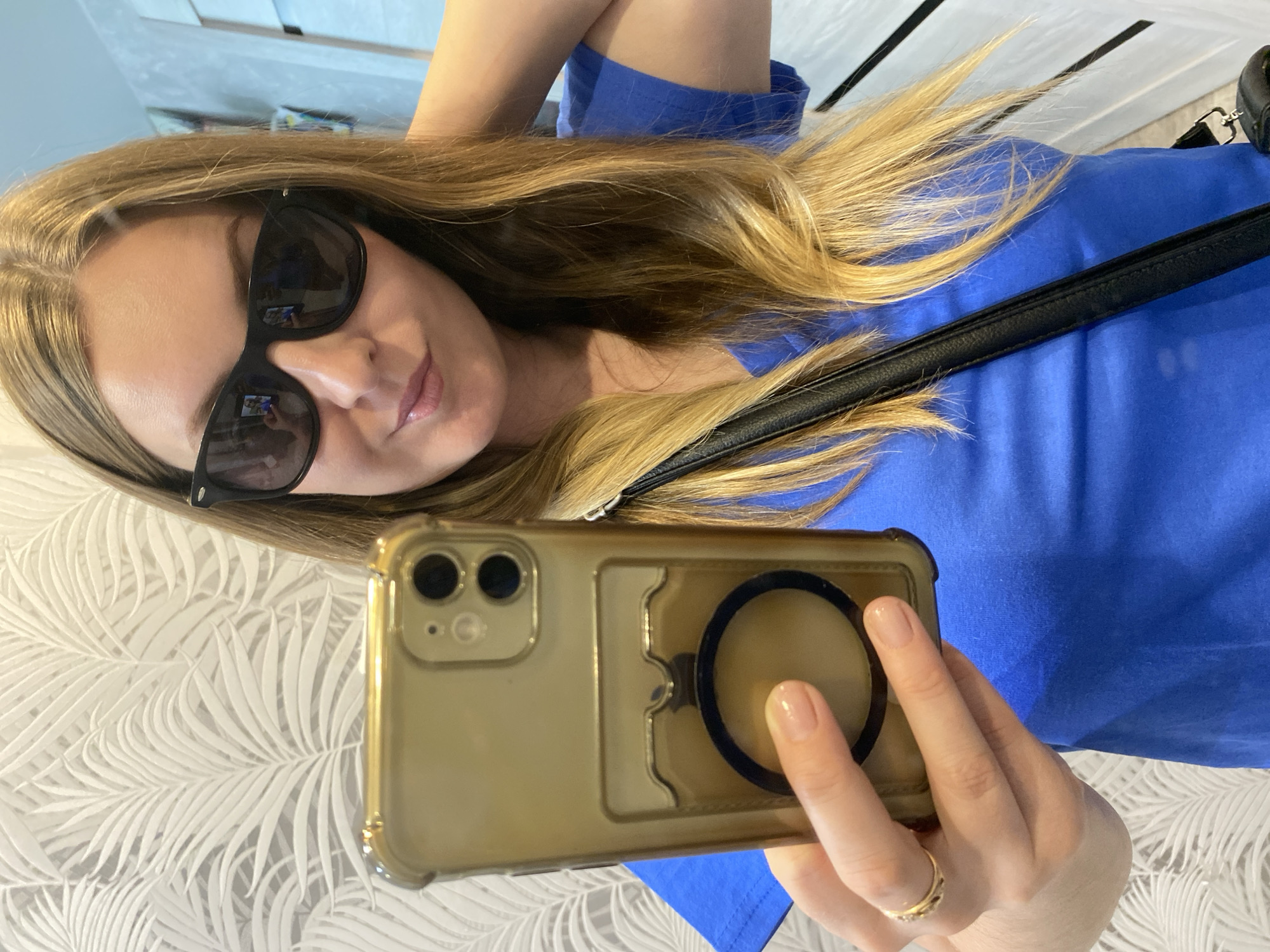 Woman takes selfies in apartment in Noviy, Russia