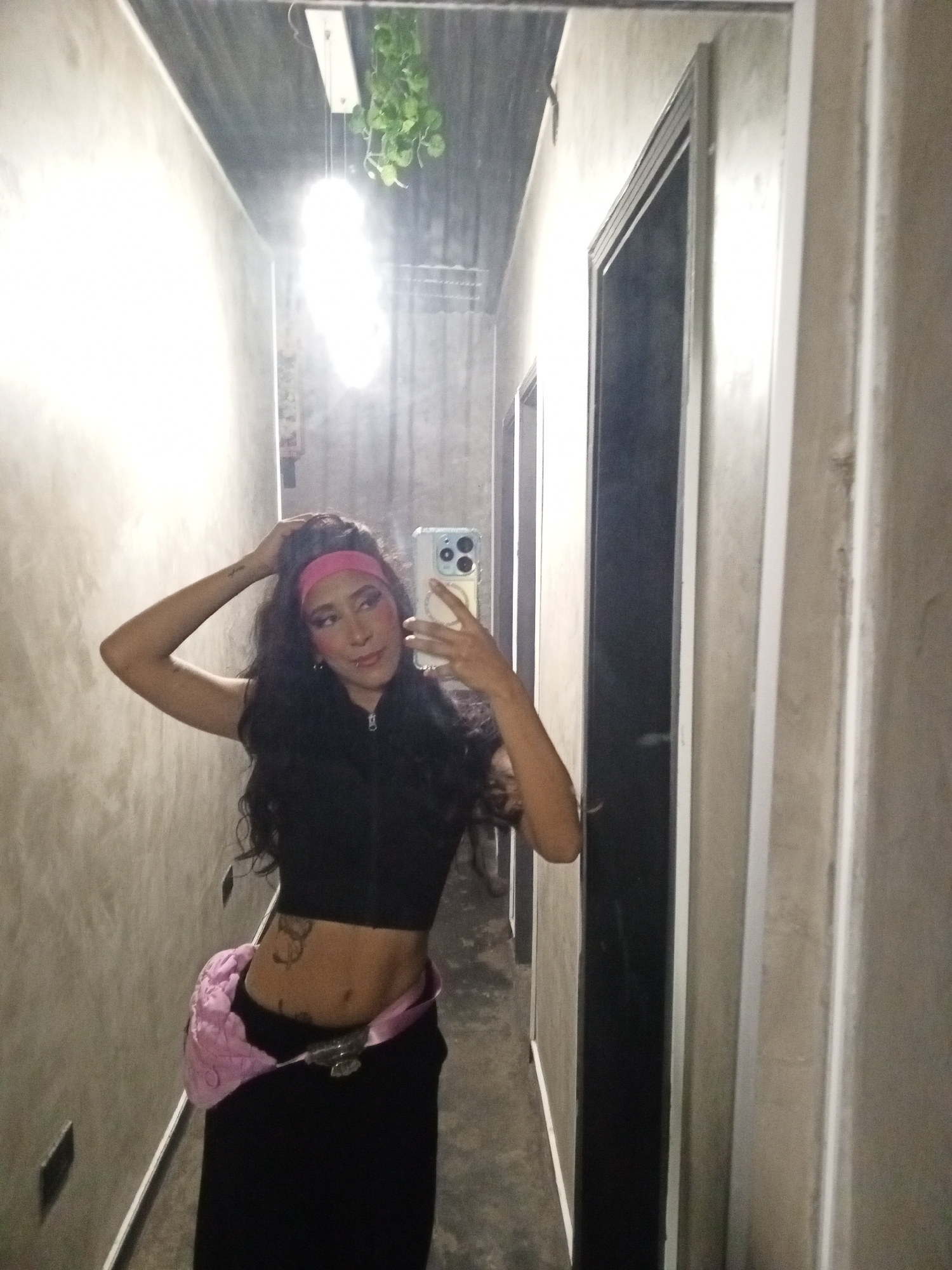 Woman Takes Mirror Selfie in Hallway